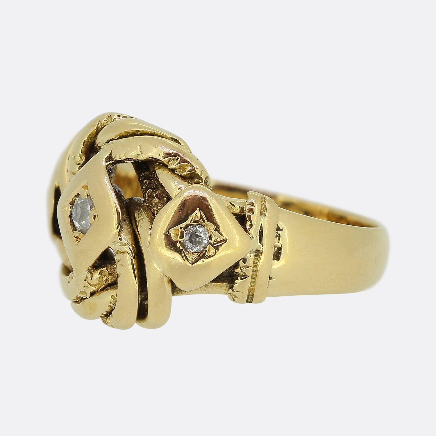 Here we have an antique knot ring from the Victorian era. This piece has been crafted from 18ct yellow gold and showcases a single old cut diamond set at the centre of a square shaped plaque. The same can be said for each smaller matching stone on