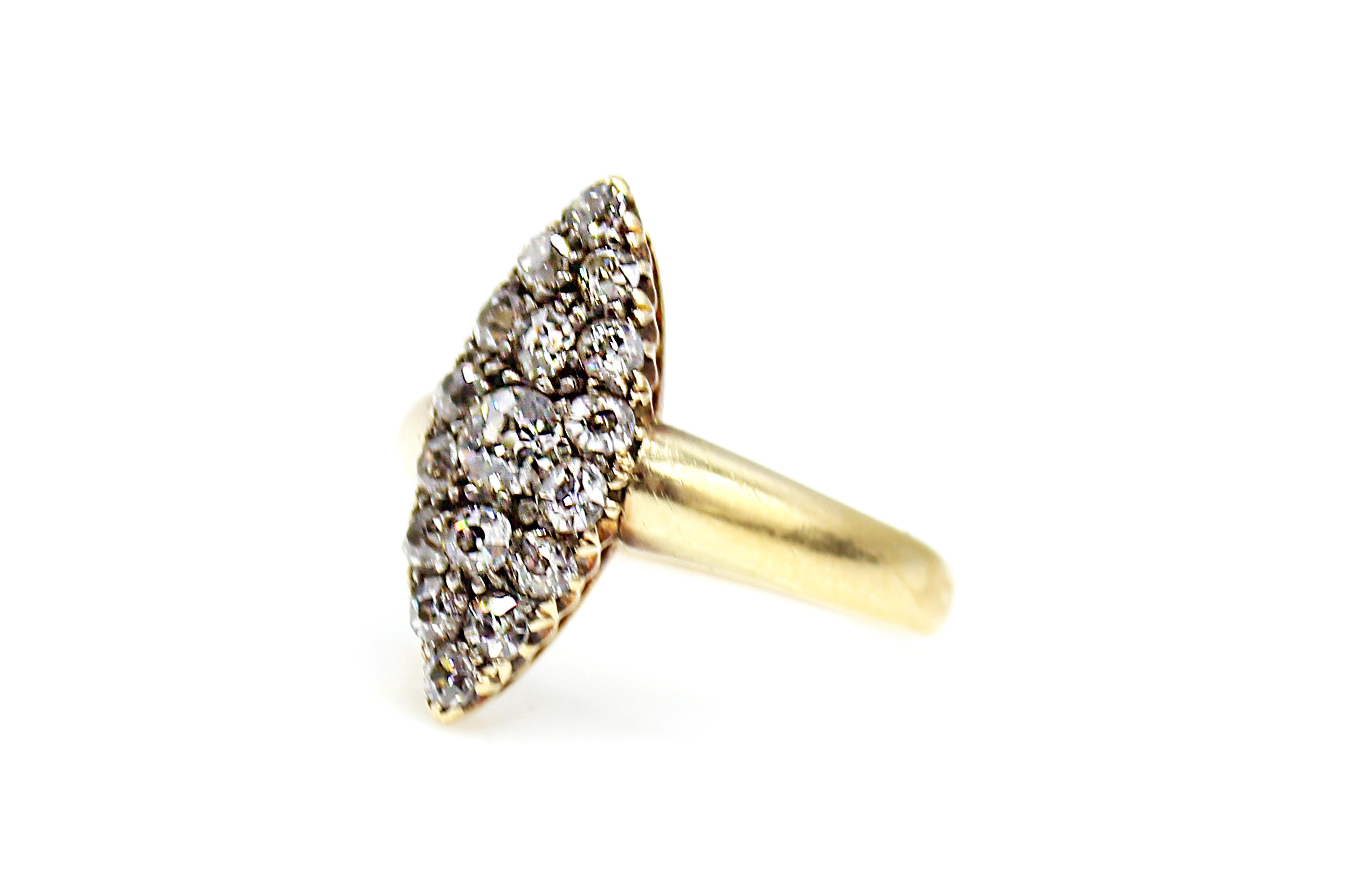 A testament to its era in which it was created, this Victorian diamond gold princess ring is masterfully hand-crafted and beautifully set. 17 Old European cut diamonds were hand-picked to match in color and cut to fit into the elegant navette shape