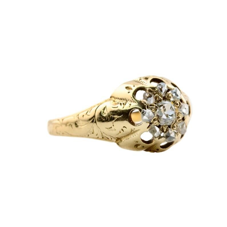 Aston Estate Jewelry présente

Bague d'époque victorienne en or jaune 18 carats, ornée d'une grappe de diamants. Au centre, un diamant taille ancienne de 0,25 carat. Elle est rehaussée d'un halo de diamants taille rose sertis en pavé de 0,32ctw. Ces