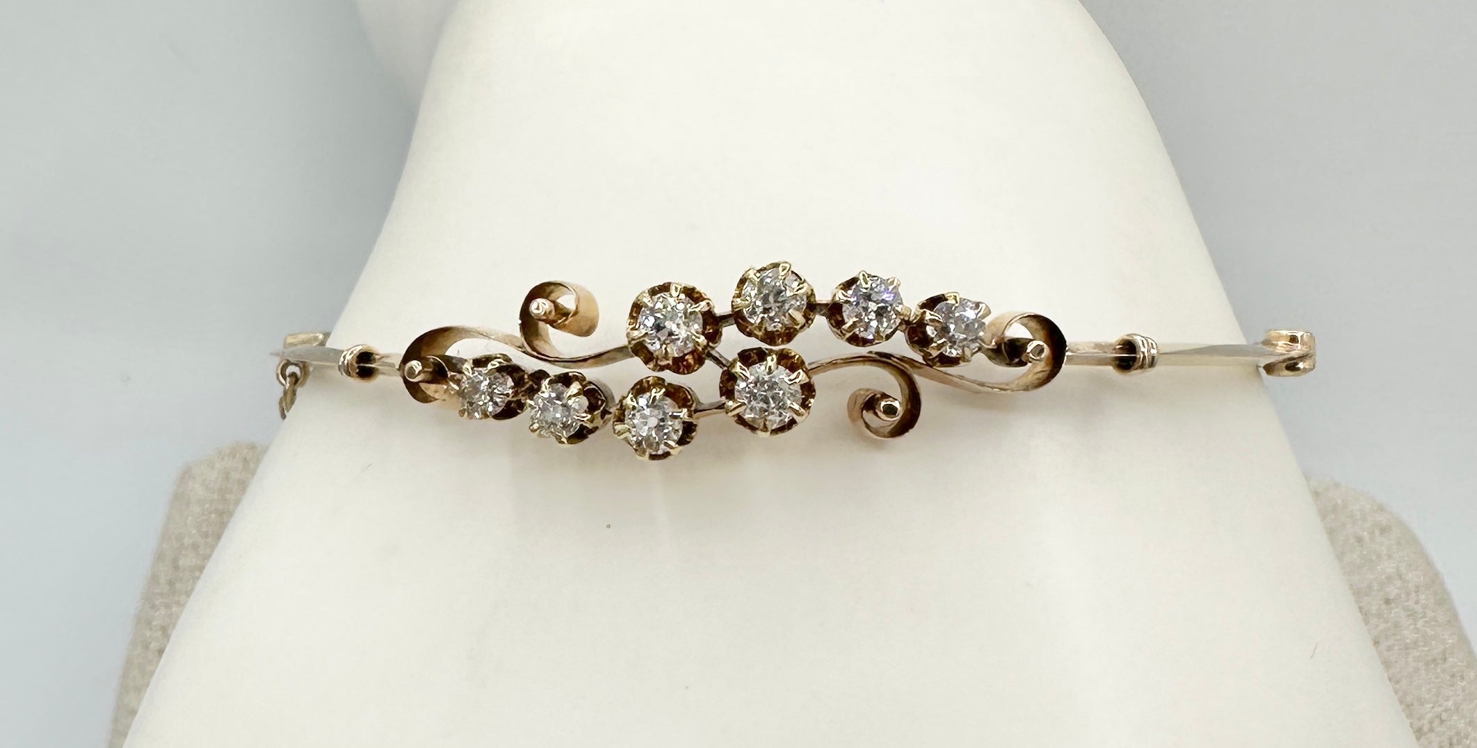 This is a gorgeous antique Victorian - Art Nouveau Bangle Bracelet with eight Old Mine Cut Diamonds in 14 Karat Yellow Gold.  The elegant and classic design is exquisite.  The sparkling white Old MIne Diamonds total approximately .85 Carats.  The