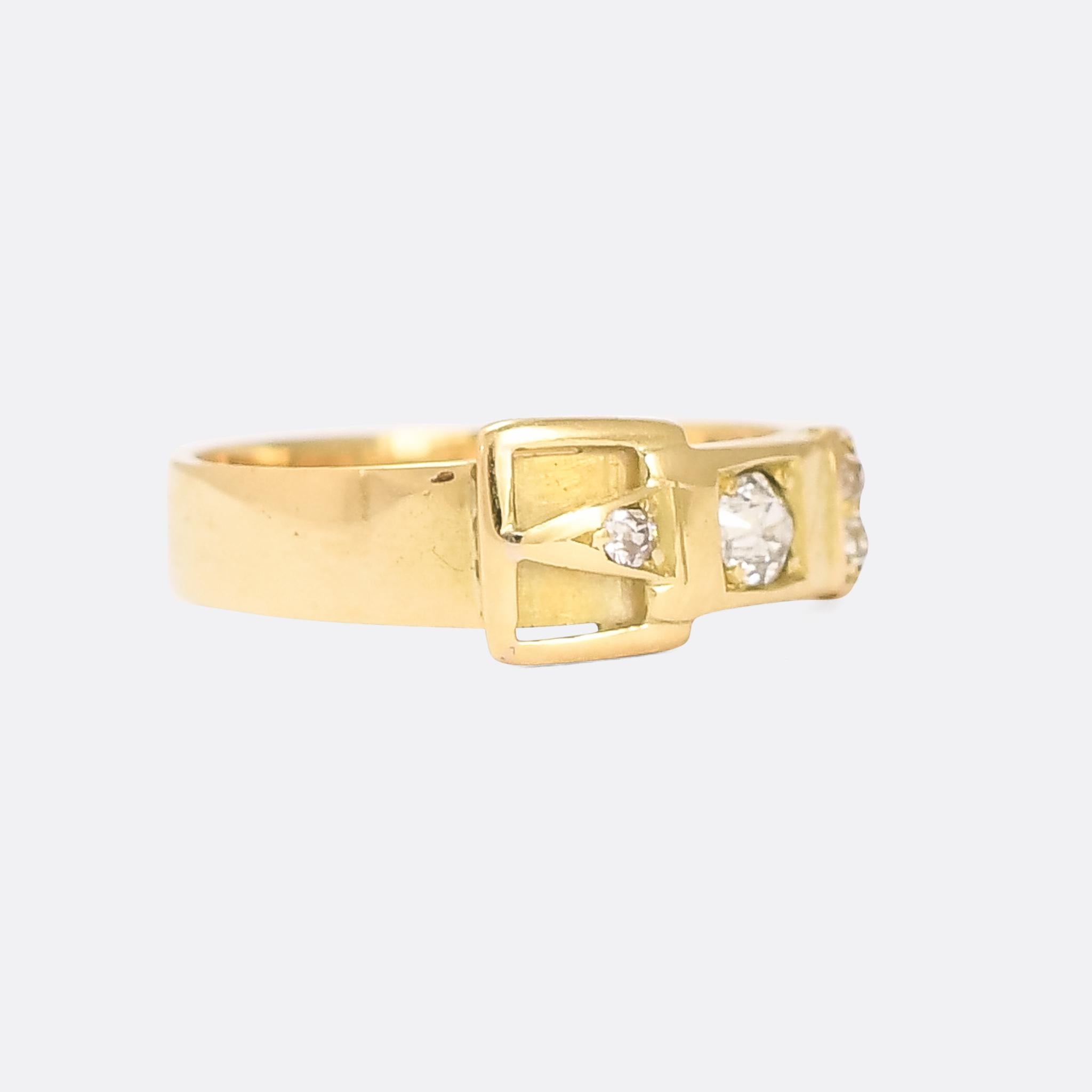 A stunning Victorian diamond-set buckle ring in 18k yellow gold. It's set with chunky old mine cut stones, totaling around 40pts, and is particularly well made and styled, with a low profile on the finger. Dating to the latter half of the 19th