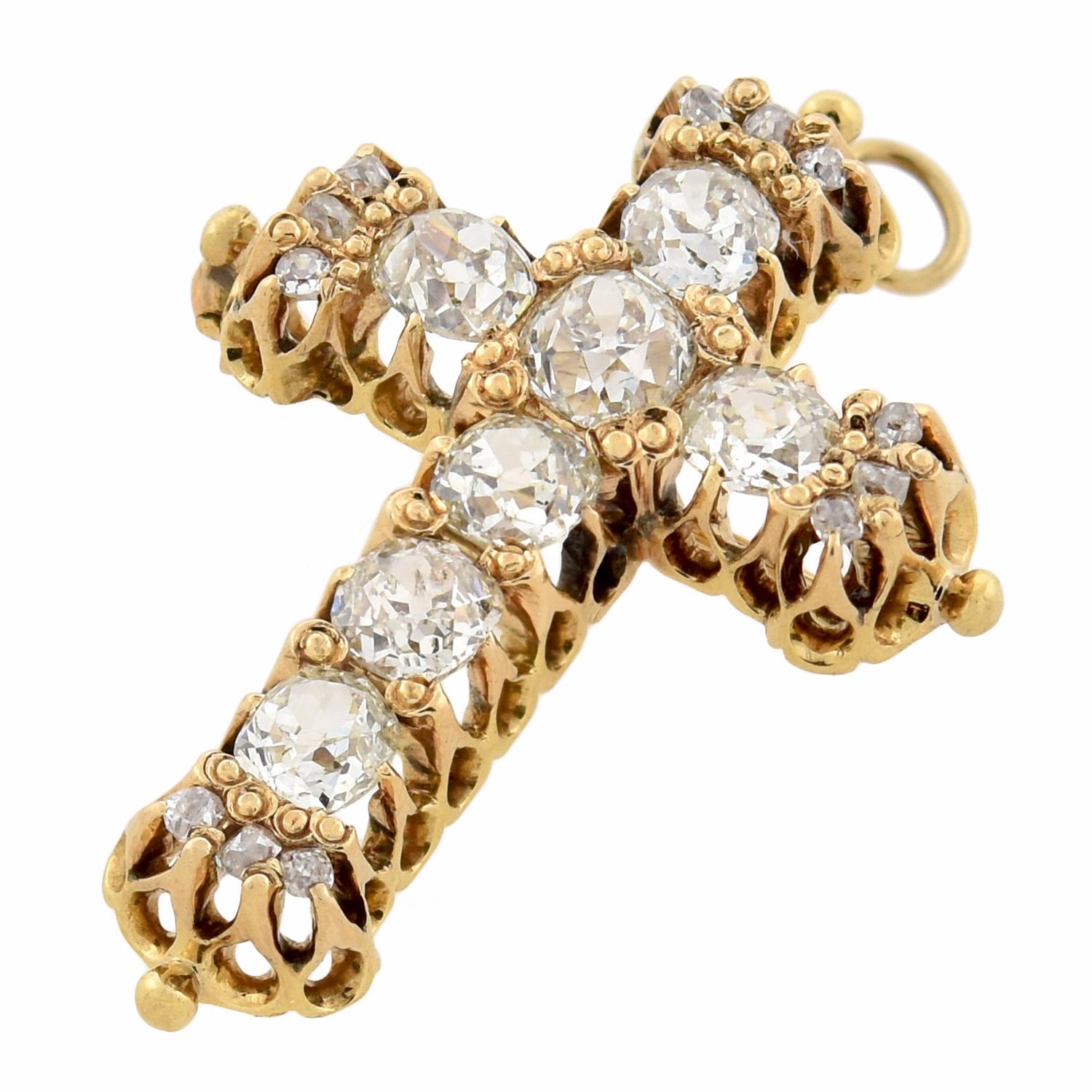 An absolutely stunning diamond cross from the Victorian (ca1880s) era! Crafted in rich 18kt yellow gold, this jaw dropping piece features seven substantially sized diamonds which line the front of the cross, which can easily be worn as a brooch or