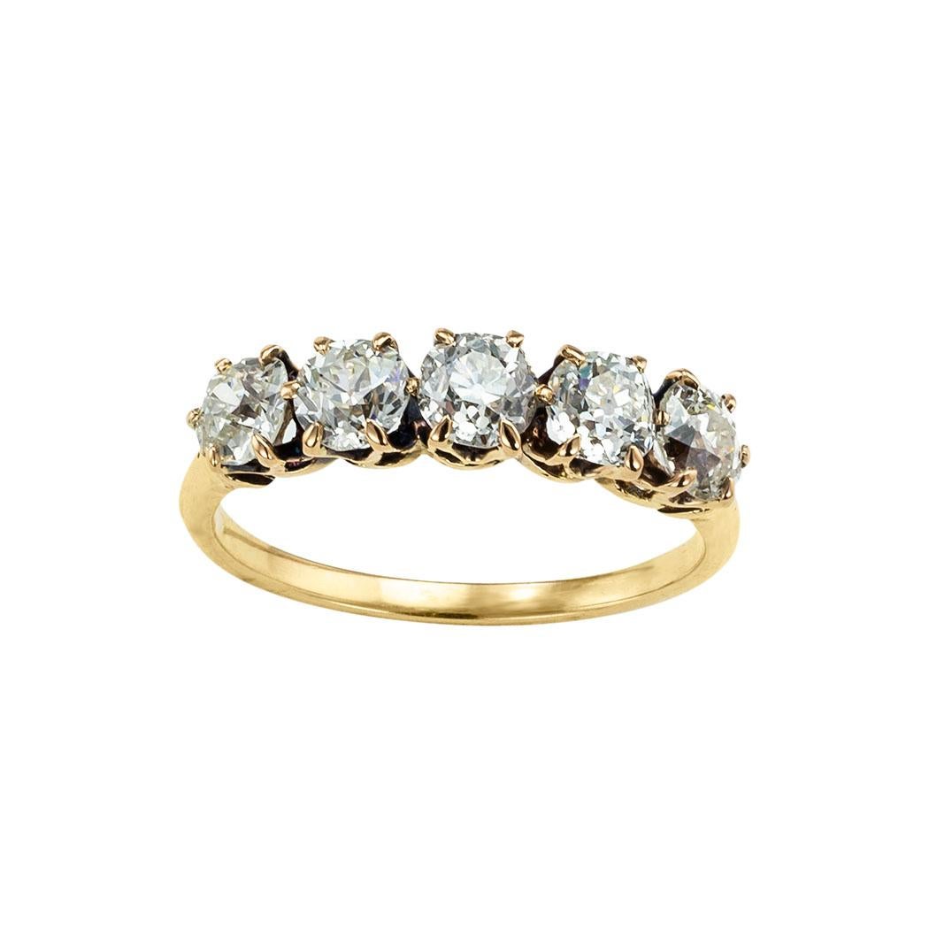 Victorian old mine cut diamonds and yellow gold five-stone gold ring circa 1900. *

ABOUT THIS ITEM:  #R-DJ627E. Scroll down for specifications.  The old mine-cut diamonds in this five-stone diamond ring are full of life and they sparkle like stars