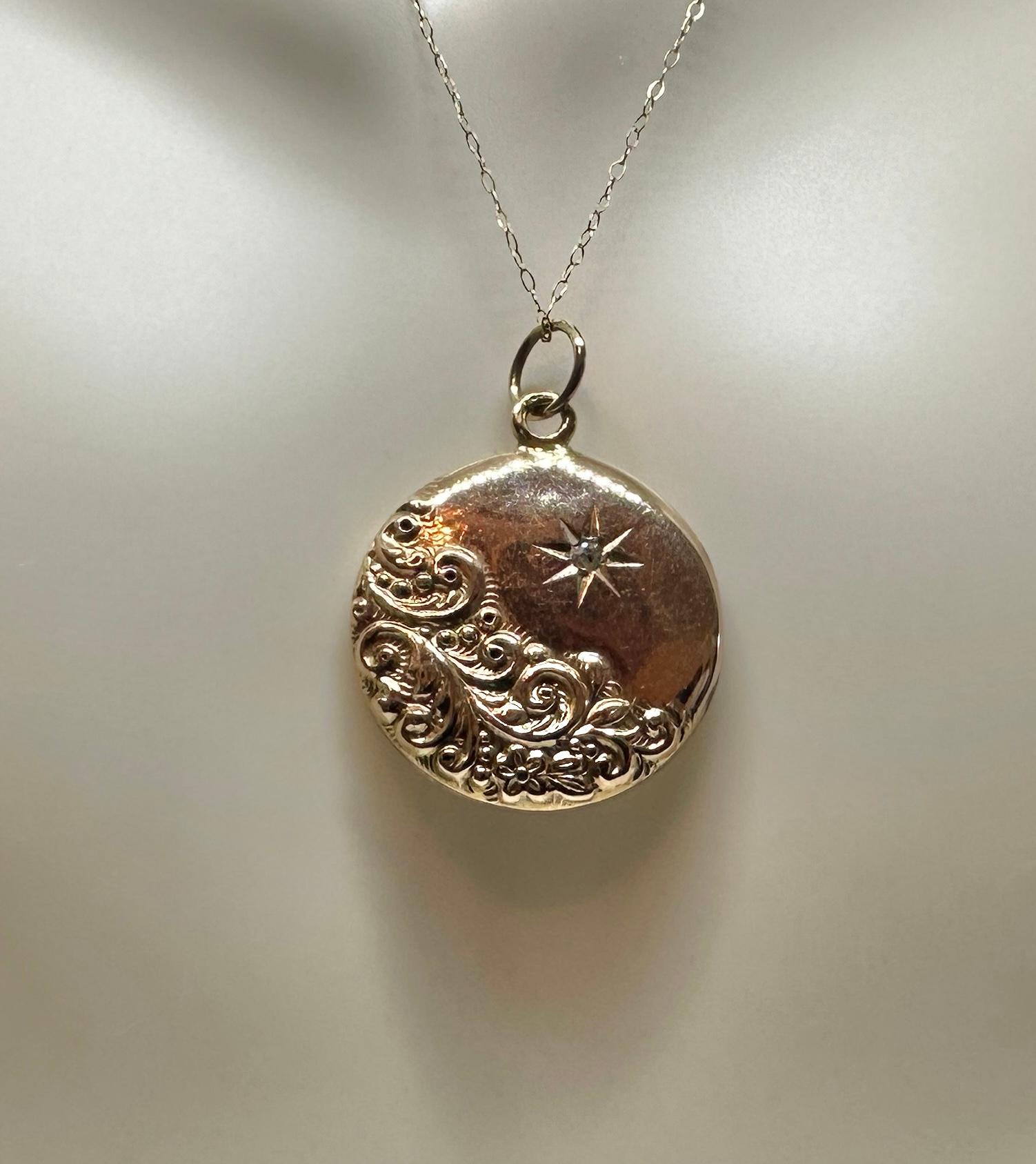 INDULGE IN A GORGEOUS VICTORIAN - BELLE EPOQUE DIAMOND PICTURE LOCKET PENDANT IN WARM 10 - 14 KARAT GOLD WITH A GORGEOUS OLD MINE CUT DIAMOND IN THE CENTER AND A FABULOUS ENGRAVED SUN MOTIF DESIGN.
This is a stunning antique Diamond Victorian Belle