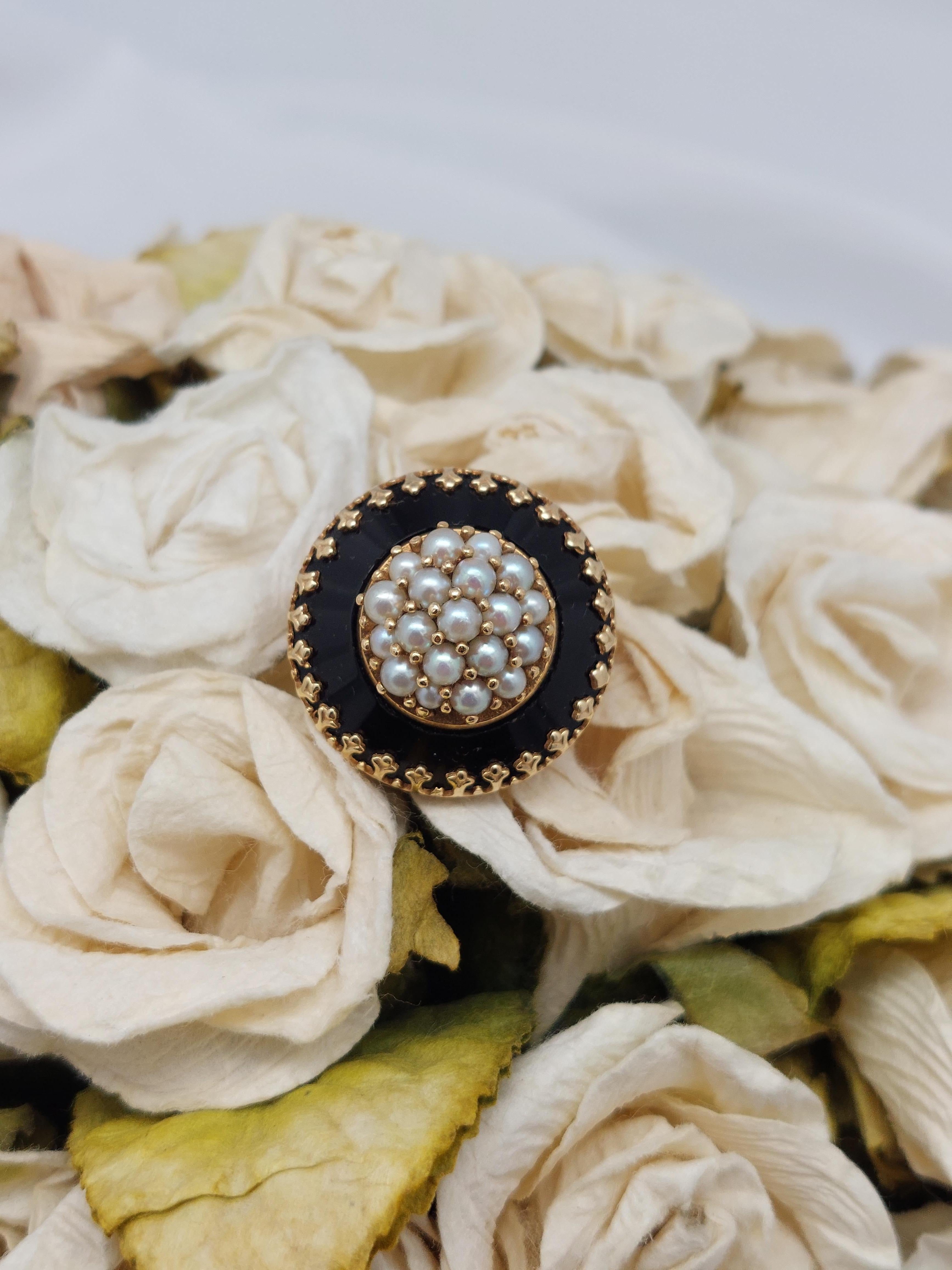 Not your typical Victorian, high design for the time period.
14 karat yellow gold with center cluster of pearls framed in Black Onyx with gold detailing
Top of the ring measures  1