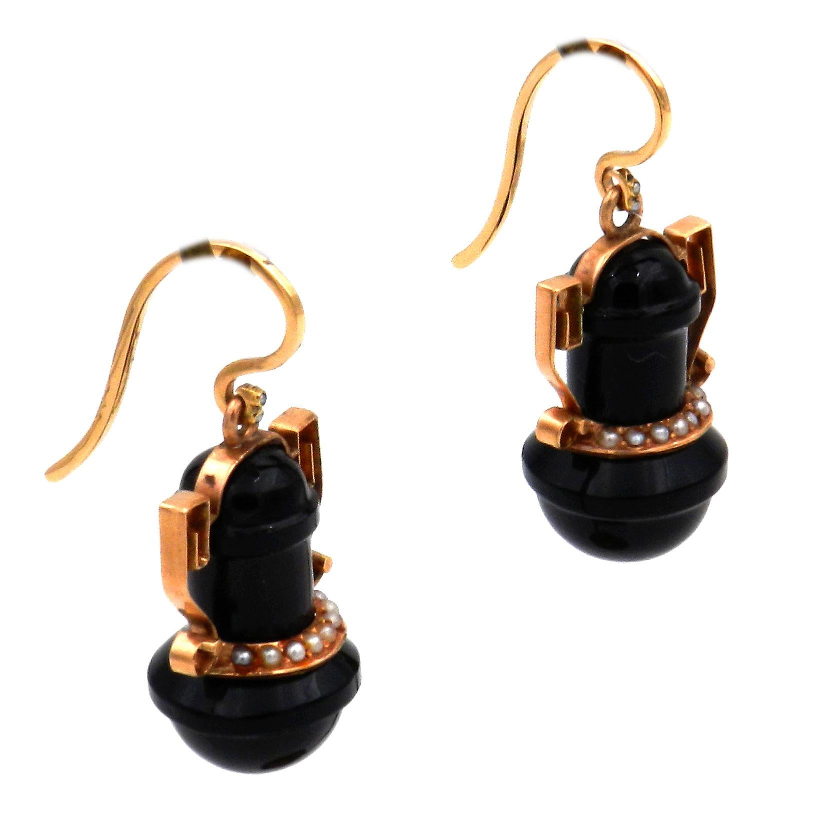 Victorian Onyx Seed Pearl 14K Rose-Gold Earrings, circa 1870

Decorative onyx earrings designed as an antique urn on a long rose-gold swan-neck hook, suspending a flexibly mounted, urn-shaped onyx teardrop with golden handles, highlighted by a band