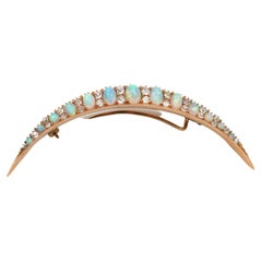 Victorian opal and diamond crescent moon brooch in yellow gold