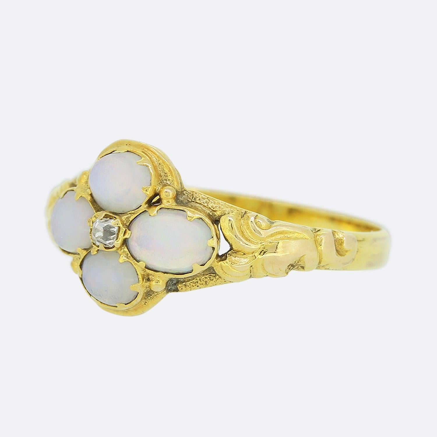 Here we have a Victorian 15ct yellow gold opal and diamond ring. The central old cut diamond is surrounded by 4 lovely opals and the shoulders feature lovely ornate detail.

Condition: Used (Very Good)
Weight: 1.5 grams
Size: M 1/2
Opals: 2 (4mm x