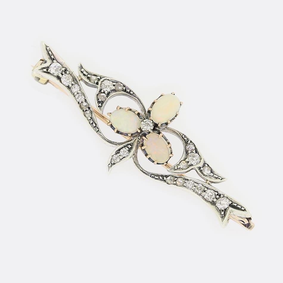 This is a Victorian 9ct yellow gold and silver brooch. The brooch has been set with three central oval cabochon opals in a clover motif with old and rose cut diamonds. 

Condition: Used (Very Good)
Weight: 4.7 grams
Dimensions: 48mm x 18mm x