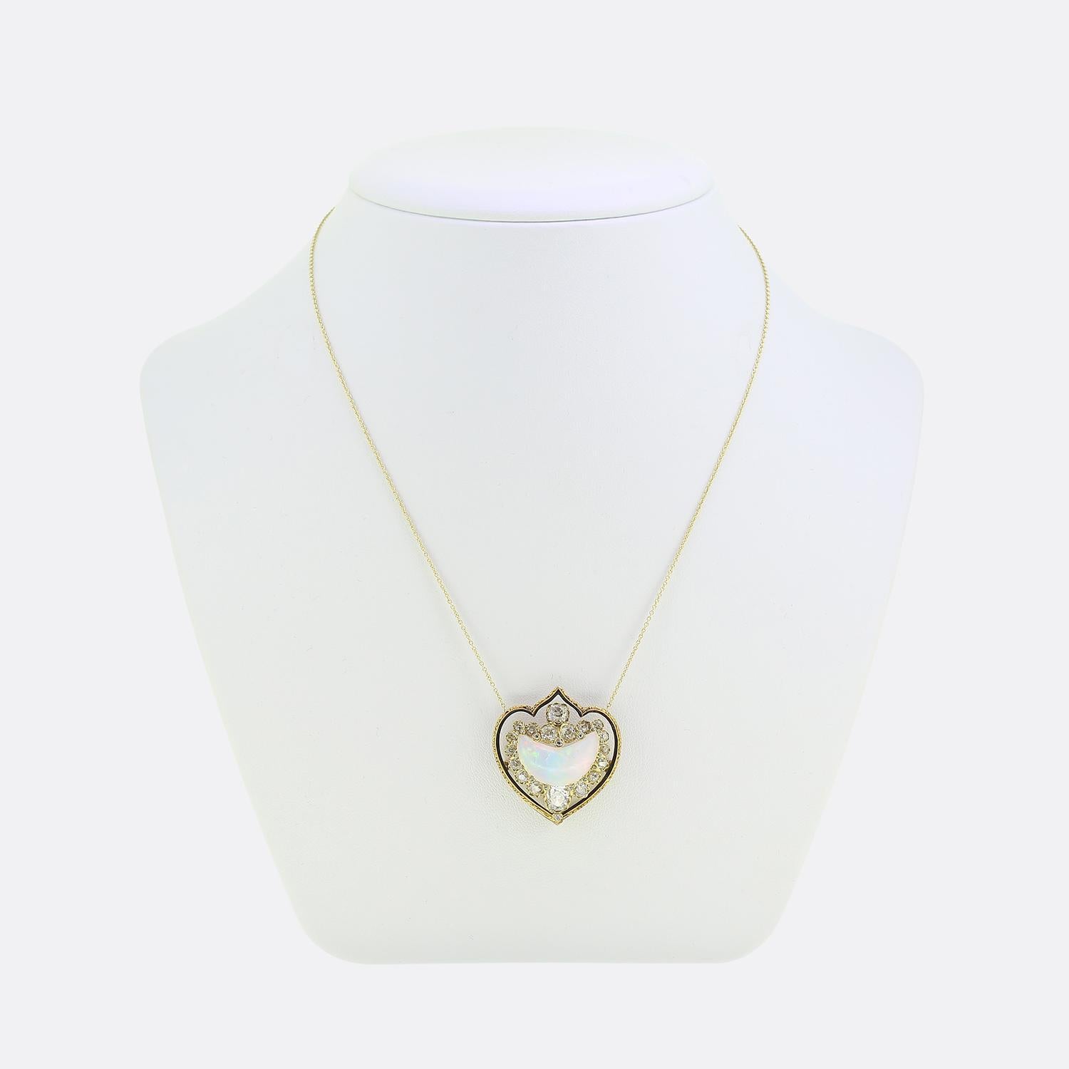Here we have a delightful necklace taken from the Victorian era. This antique pendant has been crafted from a rich 18ct yellow gold and features a resplendent crescent-shaped white opal glistening with intense flashes of blues and pink alongside