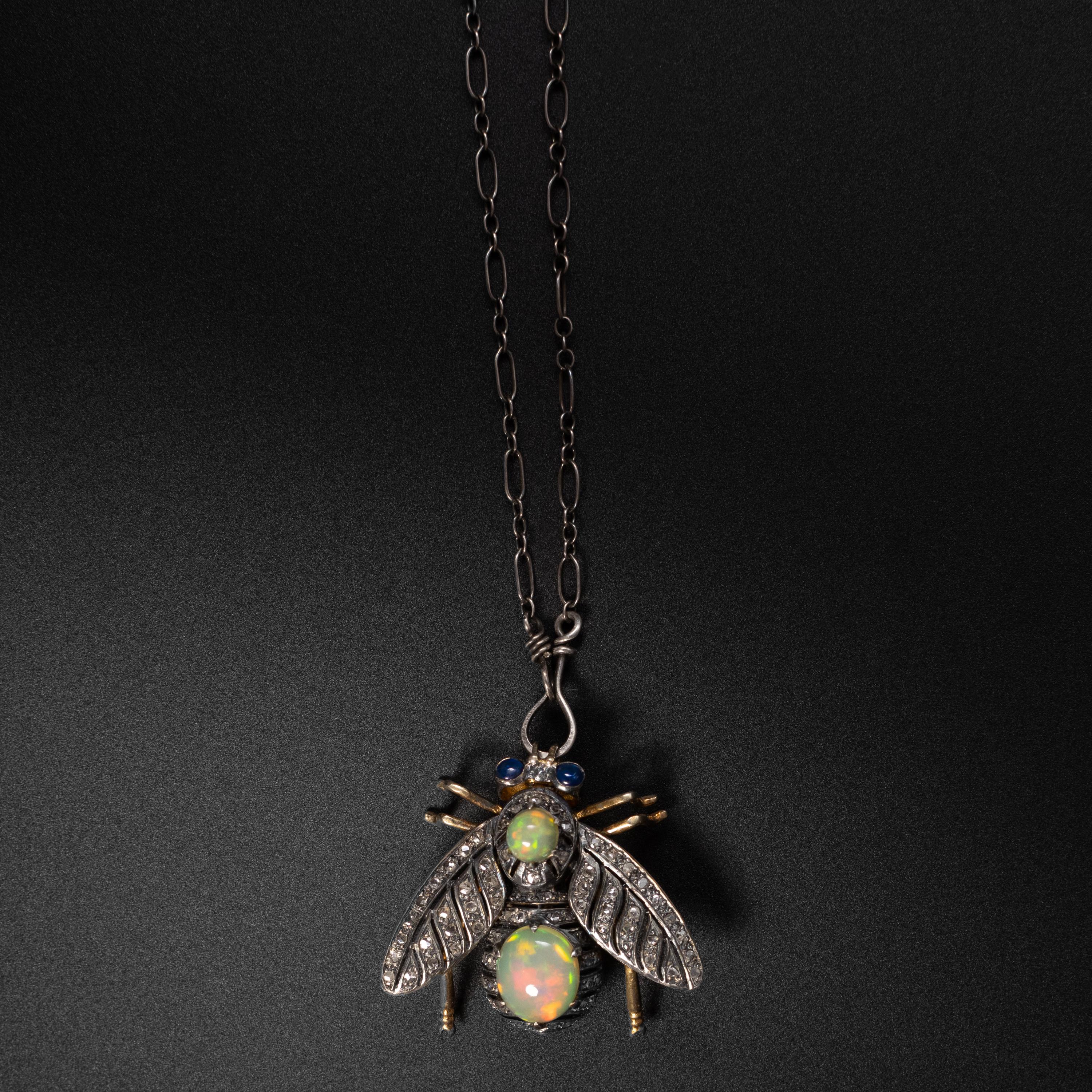 Created around 1880 this whimsical, and oh-so-rare French Victorian en tremblant pendant in silver-over-gold (18K) celebrates nature in the form of a charismatic fly with sapphire eyes, diamond-encrusted wings, and a body set with two fine-quality