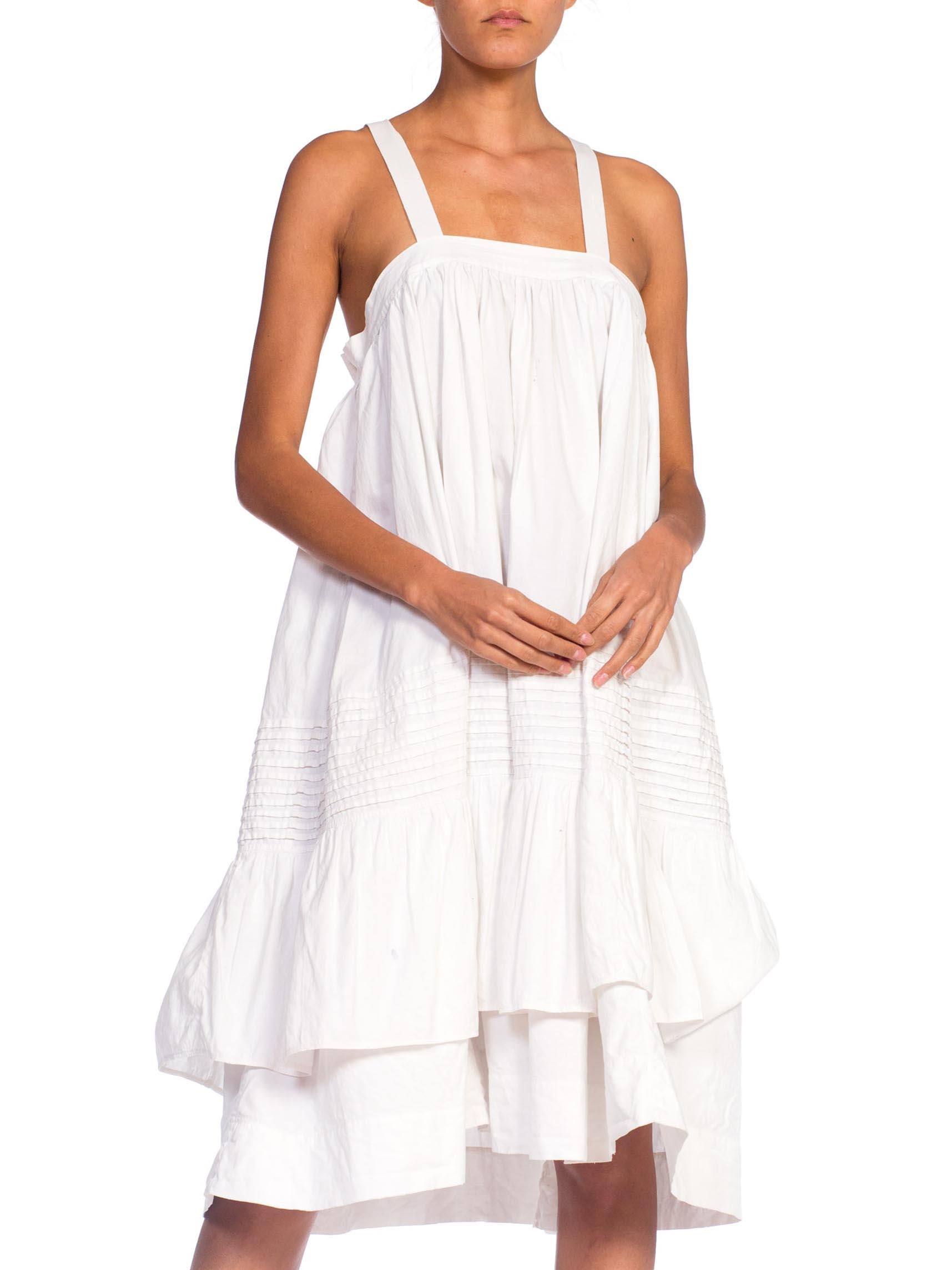 MORPHEW COLLECTION White Organic Cotton Tunic Dress Made From A Victorian Skirt
MORPHEW COLLECTION is made entirely by hand in our NYC Ateliér of rare antique materials sourced from around the globe. Our sustainable vintage materials represent over