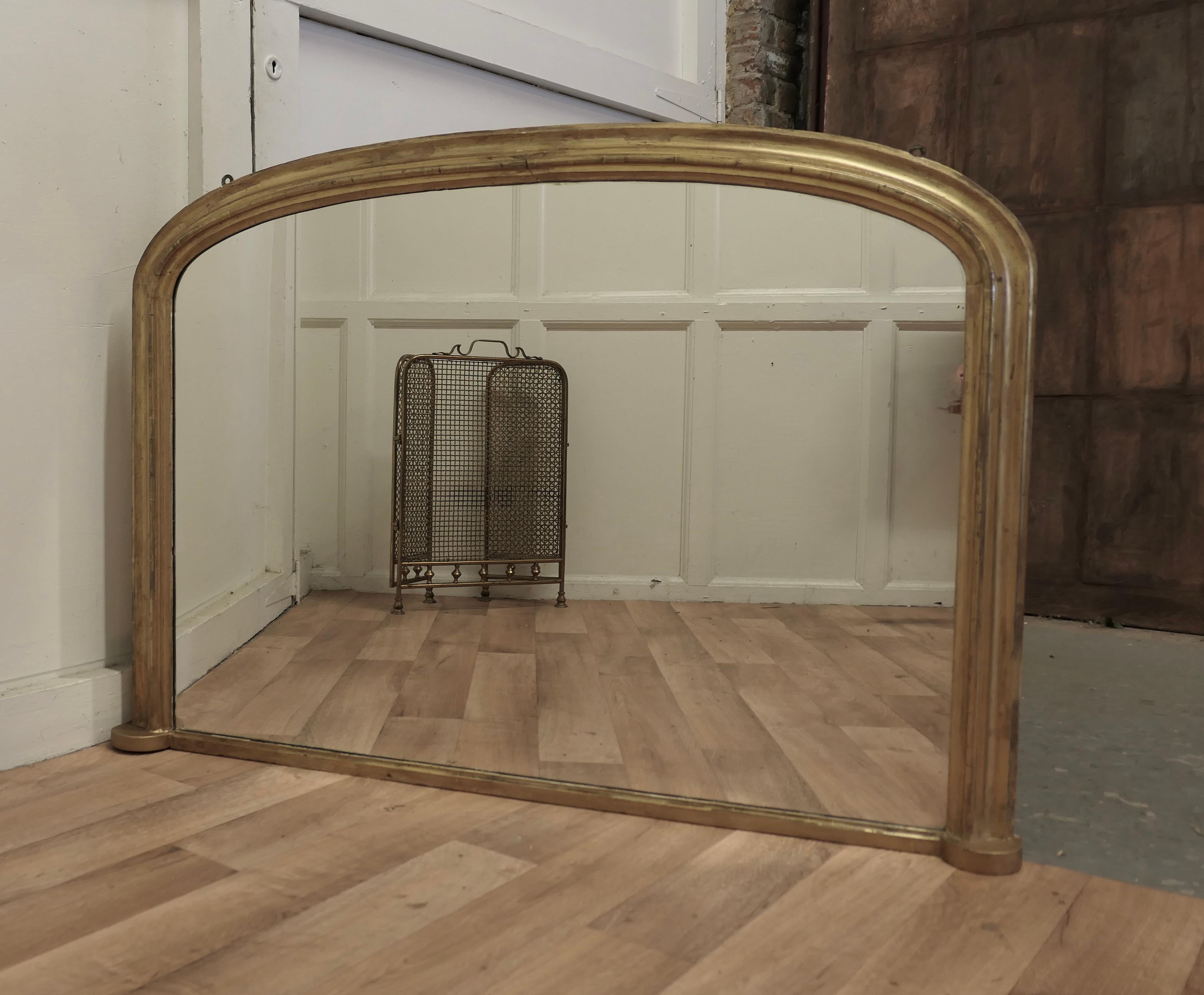 Victorian original shabby gold over-mantle mirror.

This is a charming and genuine piece of shabby chic furnishing, the 3” wide frame is in Gold with some of the gesso undercoat showing through in places 
The Mirror is in good original