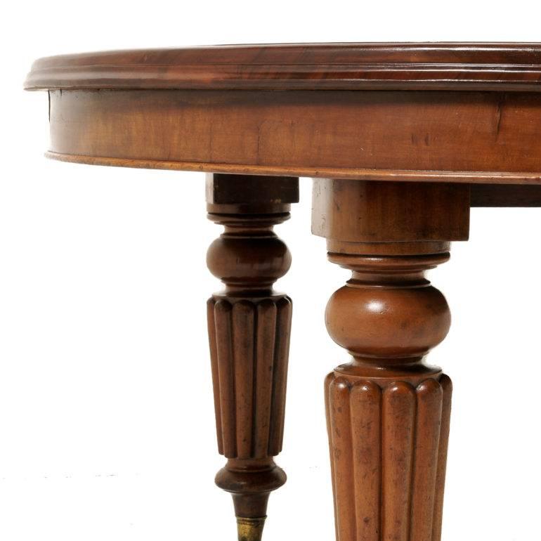 A solid mahogany English Victorian extending dining table with three leaves. Patented ‘Joseph Fitter’ crank system for extending. The table is supported on four tapering reed legs on original porcelain casters, circa 1870.


Three leaves: 22? /