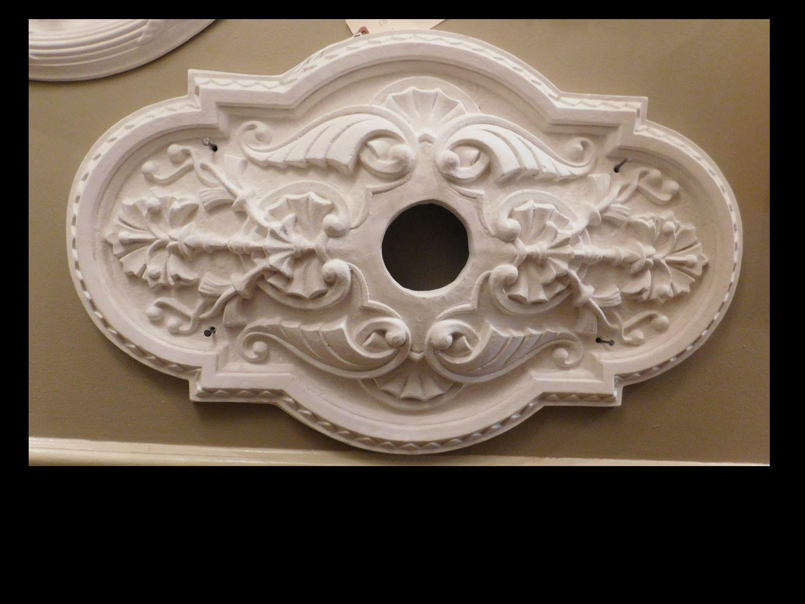 These plaster ceiling medallions are hand-cast by our own craftsman from a mold made from a period medallion in a period room. Easy to install, instructions provided. Measure: Center hole is 2.75