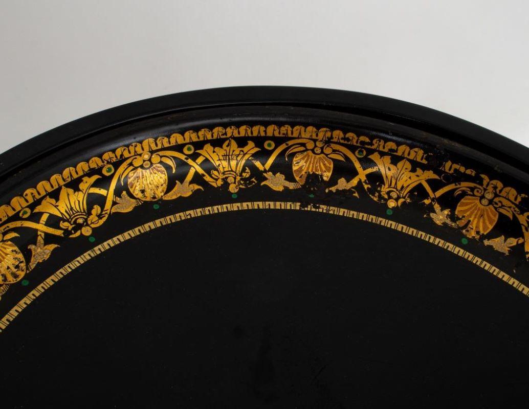 Victorian Oval Tole Tray on Later Stand, 19th century, tole tray with gilt foliage motif around edges, black legs, apparently unmarked. 22