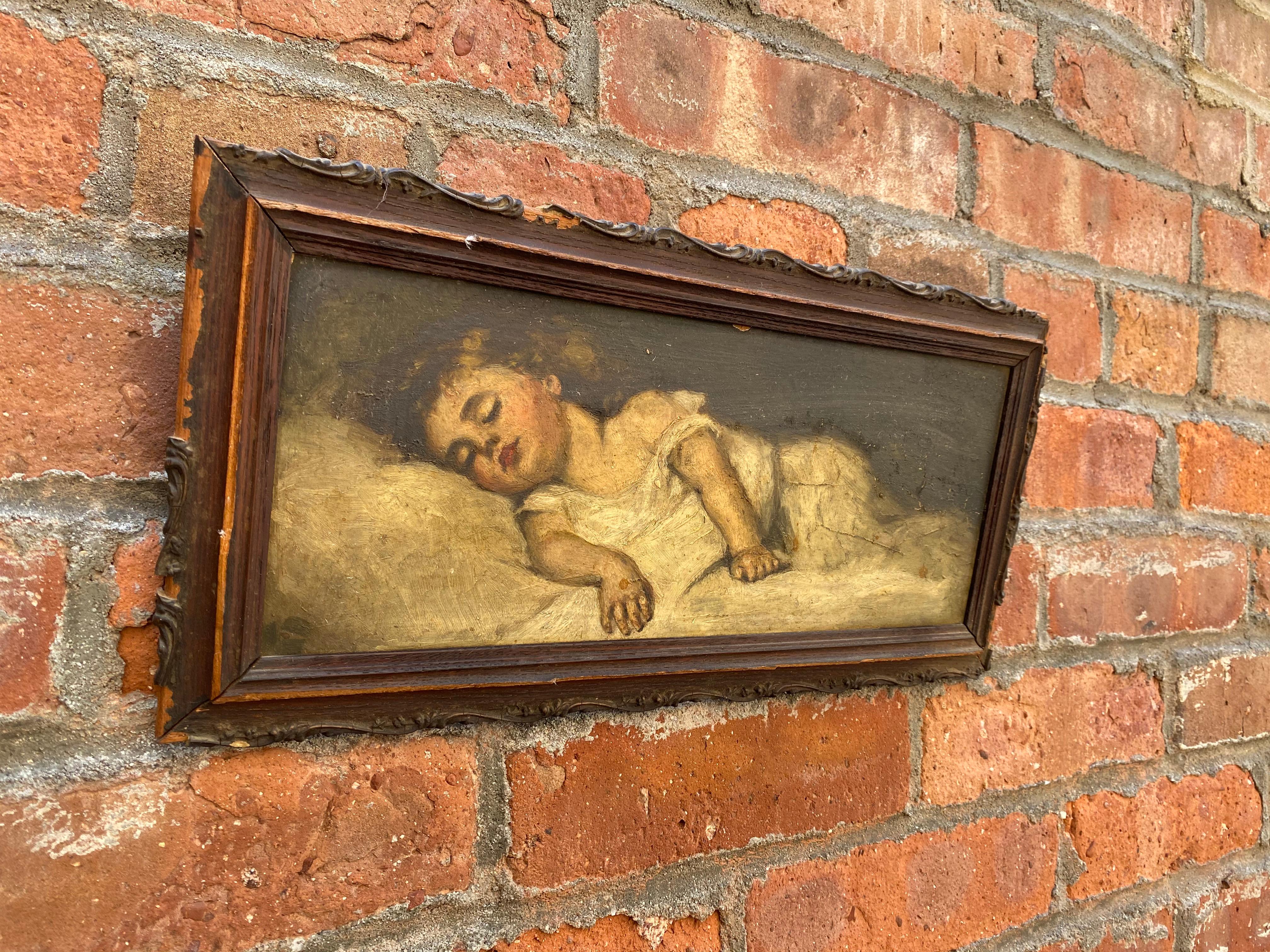 Amazingly realistic and tender Victorian Era jewel. Oil paint on board of a sleeping child. The most restful and peaceful sleep. Wonderful use of light and shadow, circa 1870-1890. Unsigned, but retains a small paper label possibly added after the