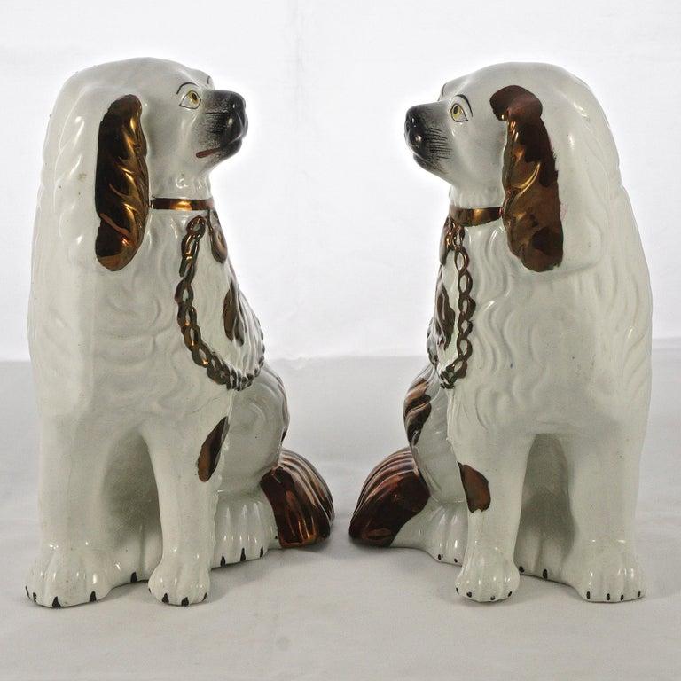 Mid-19th Century Victorian Pair of Staffordshire Pottery Copper Lustre Split Leg Dog Figurines For Sale
