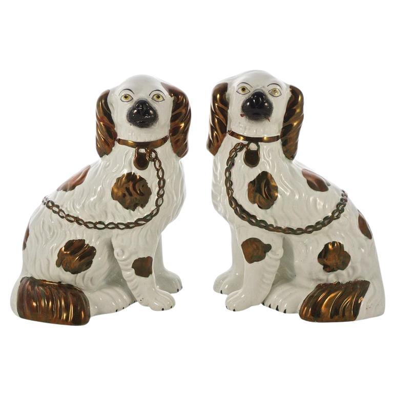 Victorian Pair of Staffordshire Pottery Copper Lustre Split Leg Dog Figurines For Sale