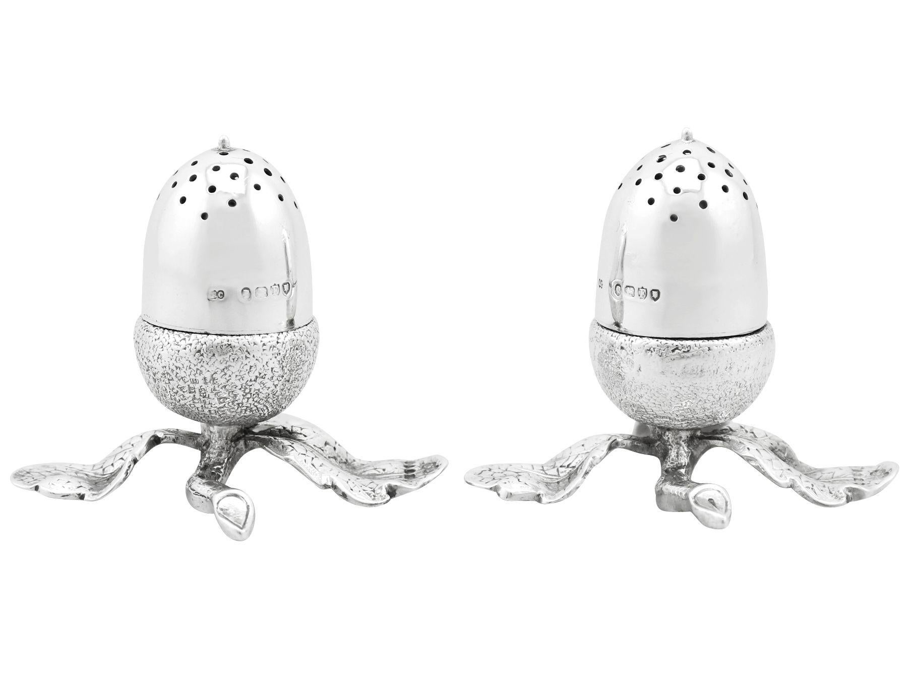 An exceptional, unusual, fine and impressive pair of antique Victorian English sterling silver acorn peppers; an addition to our silver cruets/condiments collection.

These exceptional antique Victorian English cast sterling silver peppers are