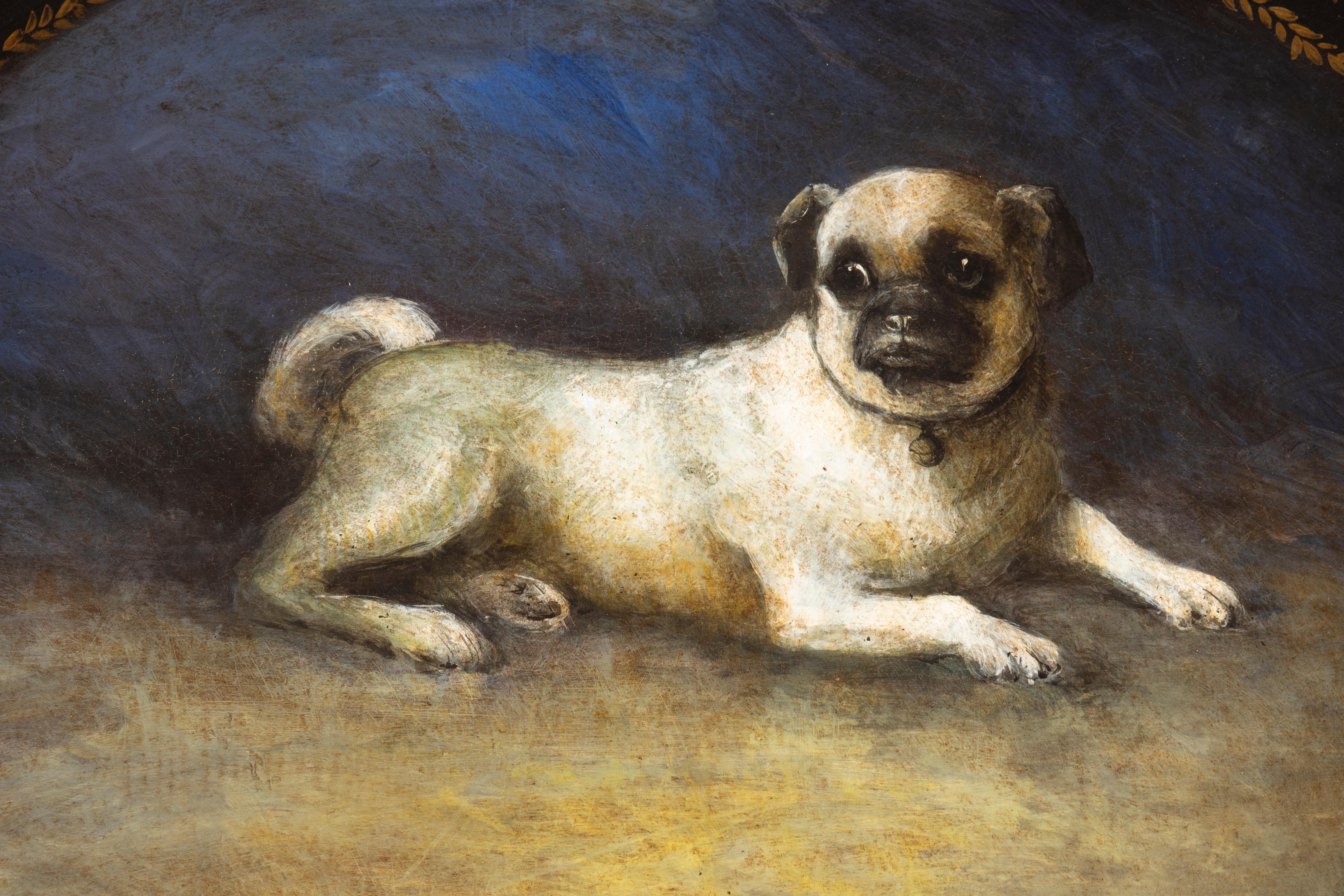 Oval with gilt edge and central painting of a pug.