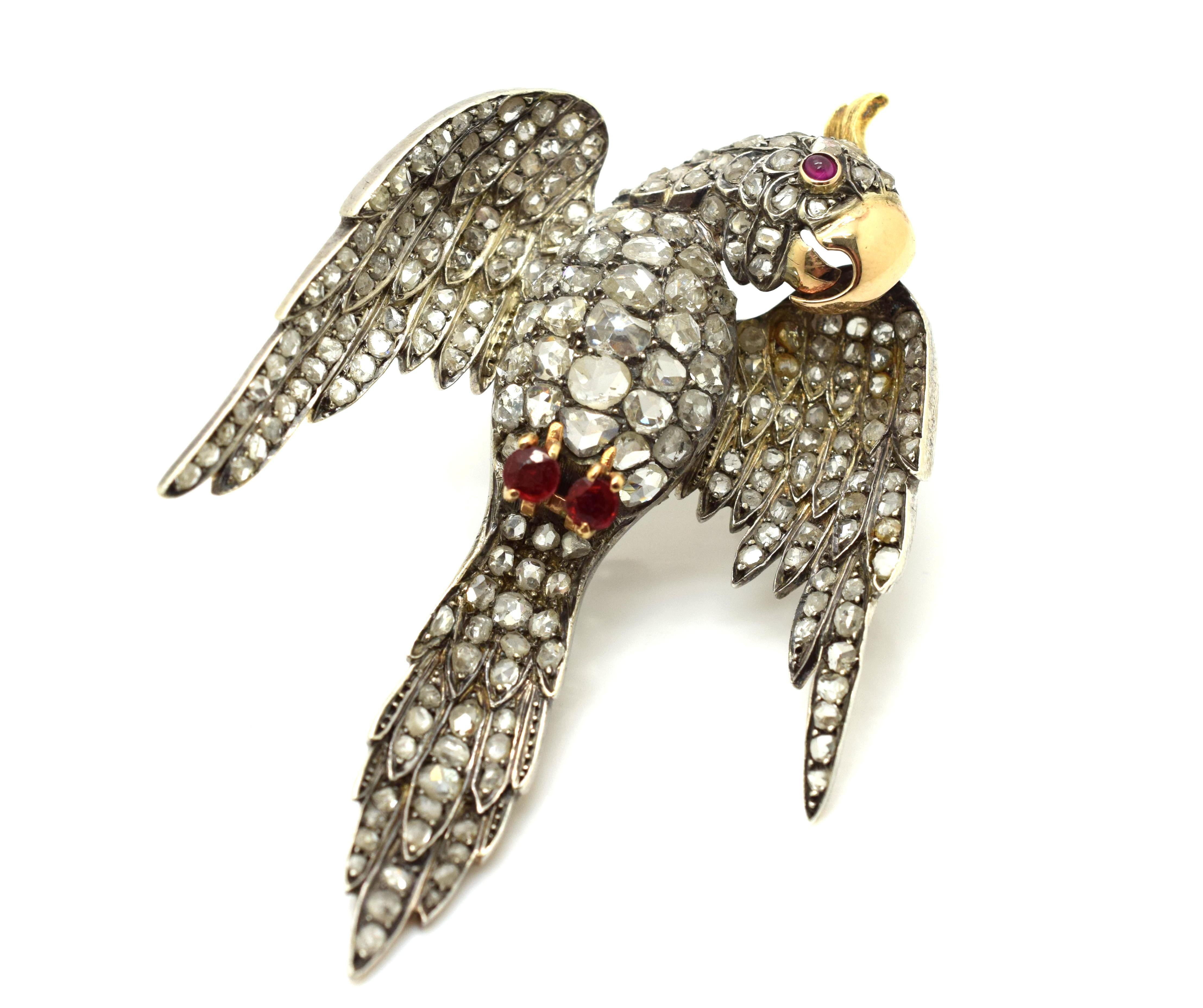One of a kind Victorian Parrot Brooch set in Silver and 18k Yellow Gold. This brooch can be fastened as a pendant or attached as a brooch. Truly a work of art this piece is set with over 20 cts. of natural Rose Cut Diamonds ranging in sizes