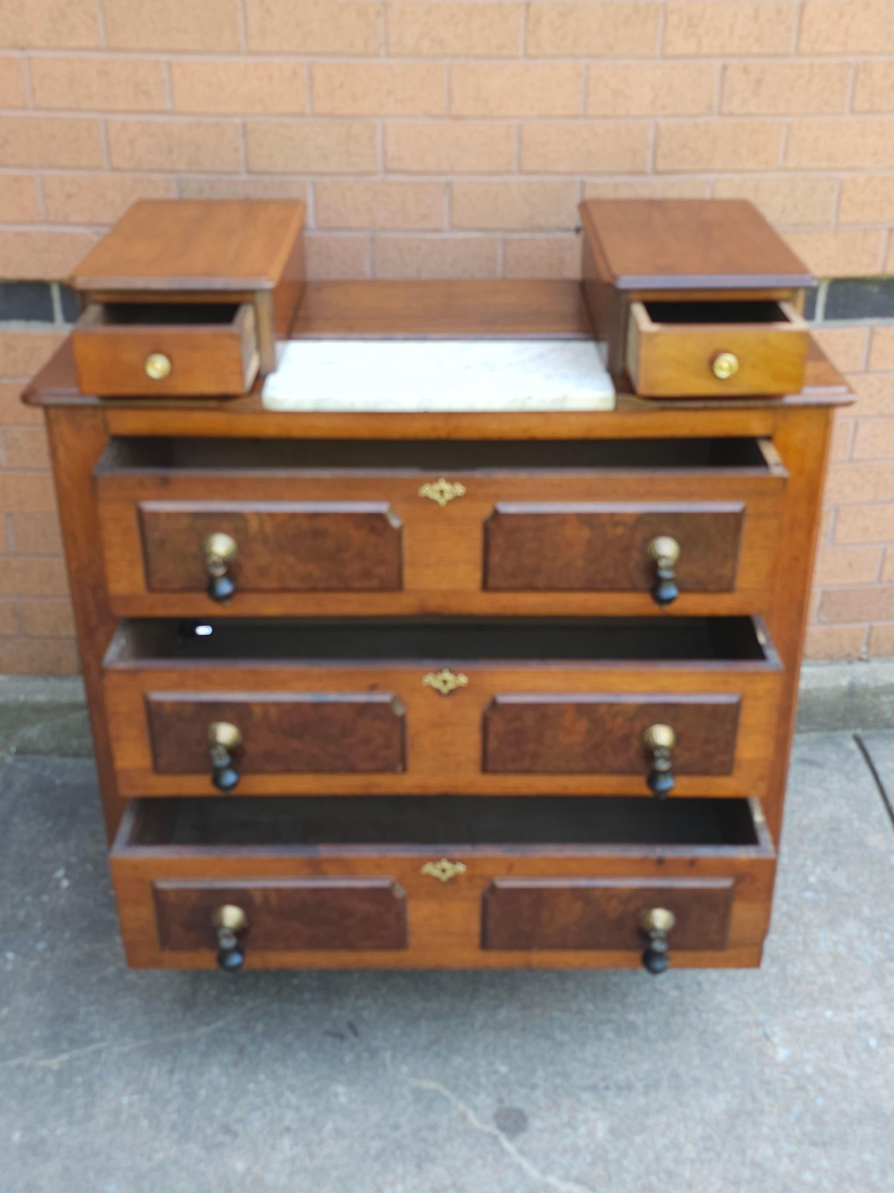 A Victorian Partial Burled Mahogany Chest of Drawers measuring 38.5
