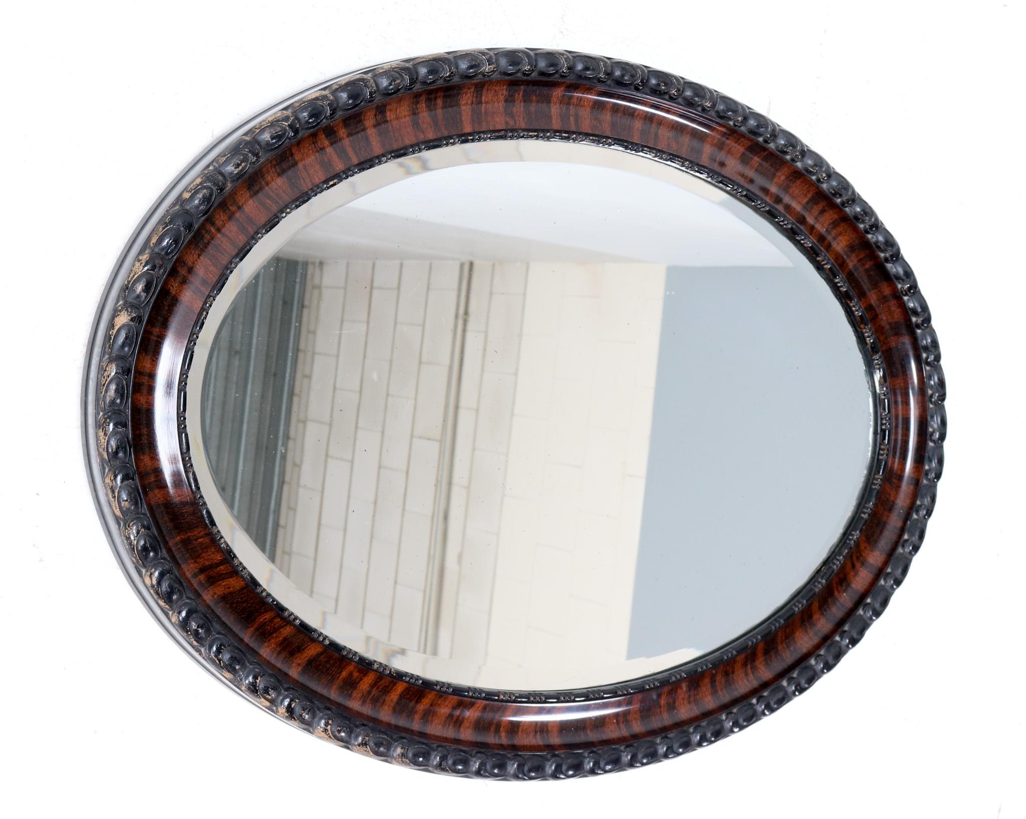 Stunning and rare Victorian wall mirror.
Striking Dutch design from the 1890s.
Patinated plaster and wooden frame with the original beveled mirror.
This wonderful Victorian wall mirror is in very good original condition with minor wear consistent