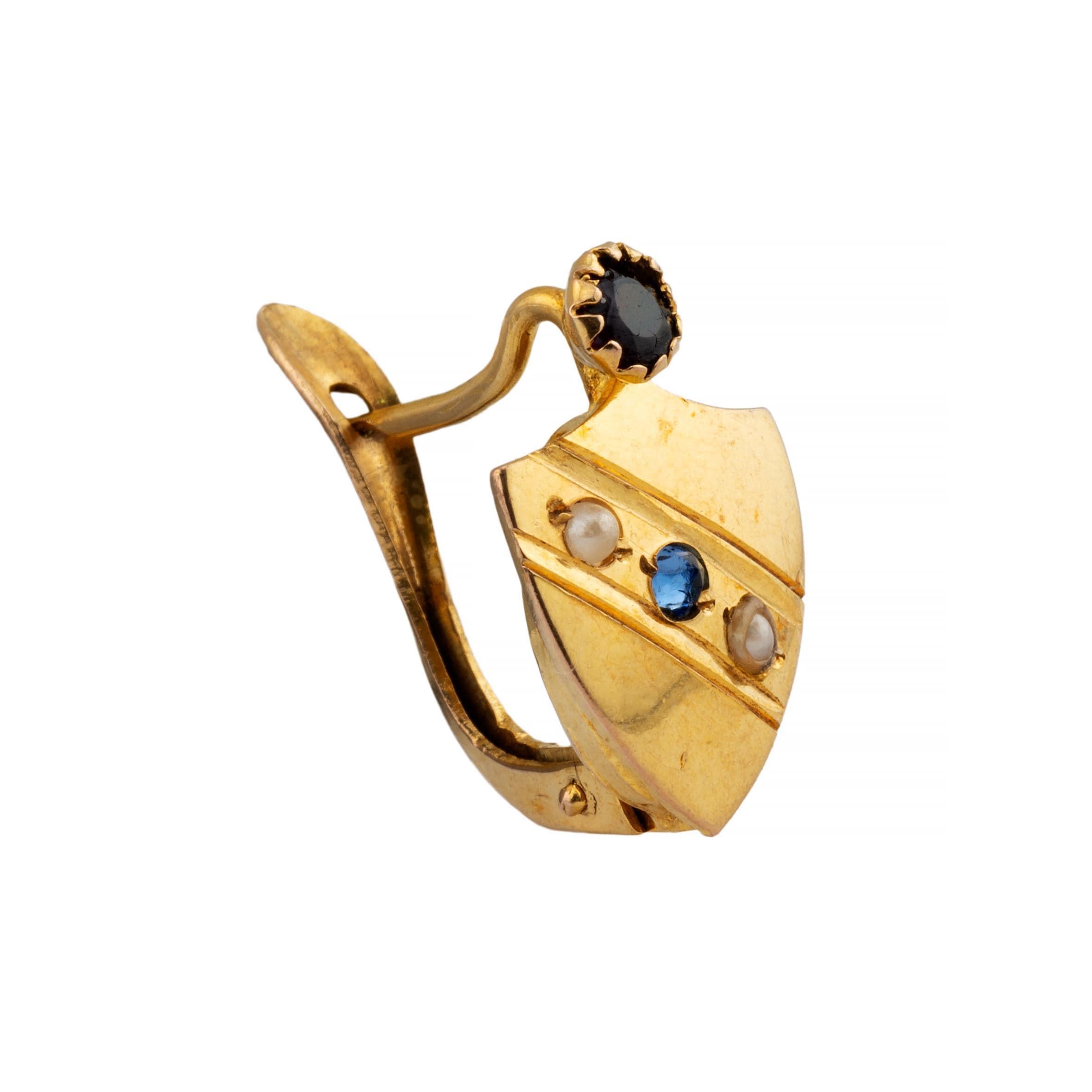 Aston Estate Jewelry Presents:

A fun pair of victorian period patriotic theme earrings.  Designed as a shield topped with a bezel set ruby. Centered by a diagonal stripe of white pearls and blue rose cut sapphire.  Dating to the time of the civil