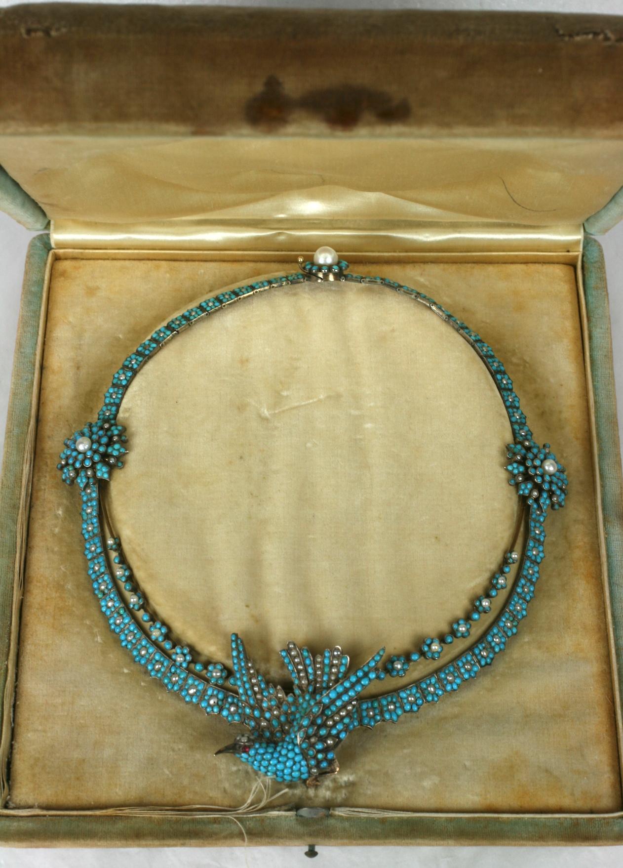 Spectacular Victorian Pave Turquoise and Pearl Sparrow Necklace from the mid 19th Century. Extremely high quality manufacture with fitted box as well as a hair comb fitting to convert bird into a trembling hair pick.
Crafted of silver topped gold