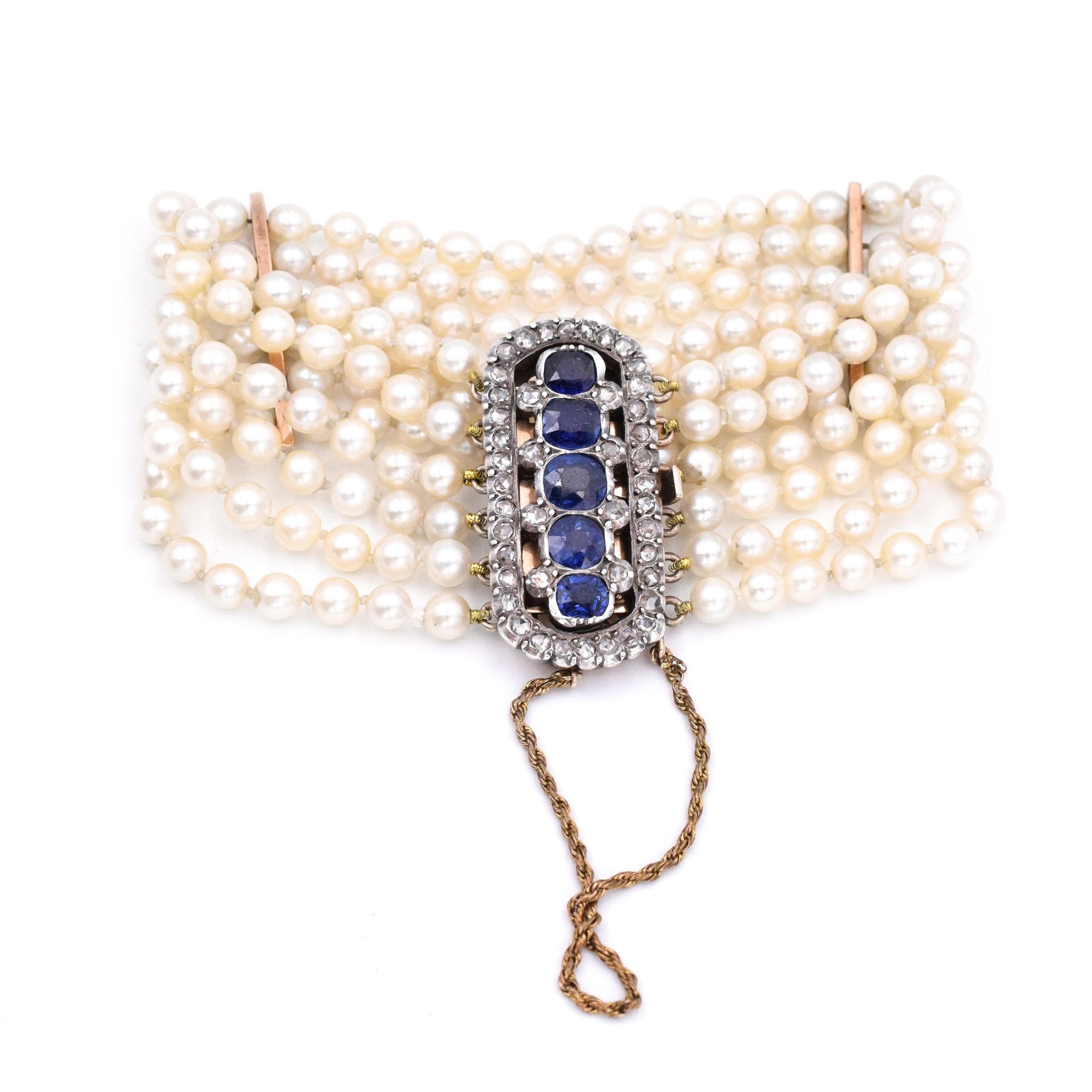 Made in 14k rose gold and platinum, with 6 strands of 3 mm pearl bracelet, measuring 29mm wide, adorned with sapphire & diamond box clasp. The clasp is set with 5 cushion cut sapphires, and 44 rosecut diamonds, measurements: 35mm X 15mm. Wrist size: