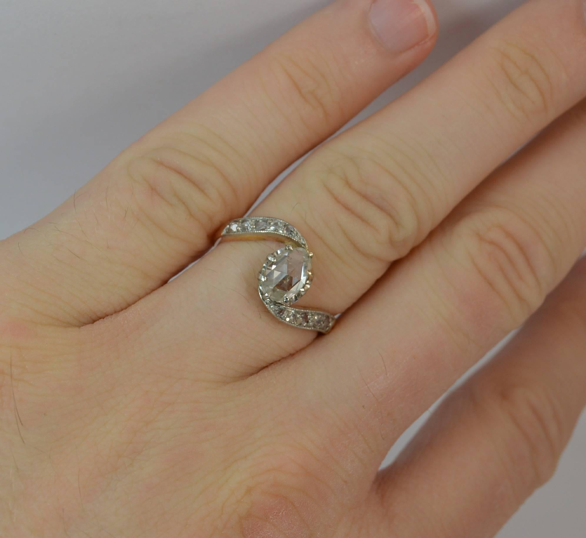 
A stunning French made Victorian period 18ct gold and diamond ring.

​Designed with a very large natural pear shaped rose cut diamond to centre, 5mm x 7.2mm, spreading over 0.75 carats. A further five rose cut diamonds are set to each