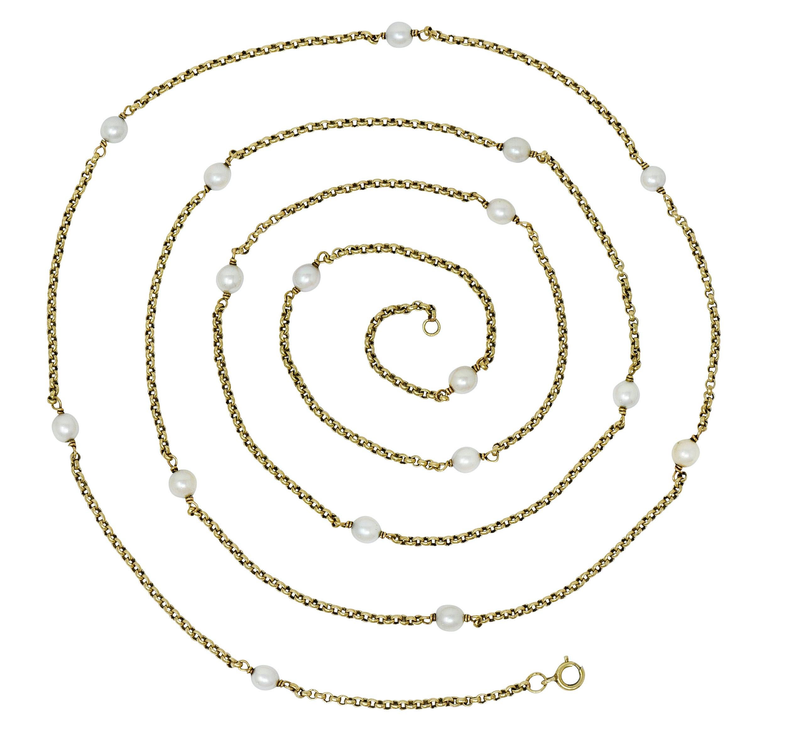 Long rolo chain necklace with pigtailed pearl stations throughout, measuring 5.3 mm to 5.8 mm

Gray and cream in body color with strong spectral overtones and most feature an excellent luster

Completed by a spring ring clasp

With French assay