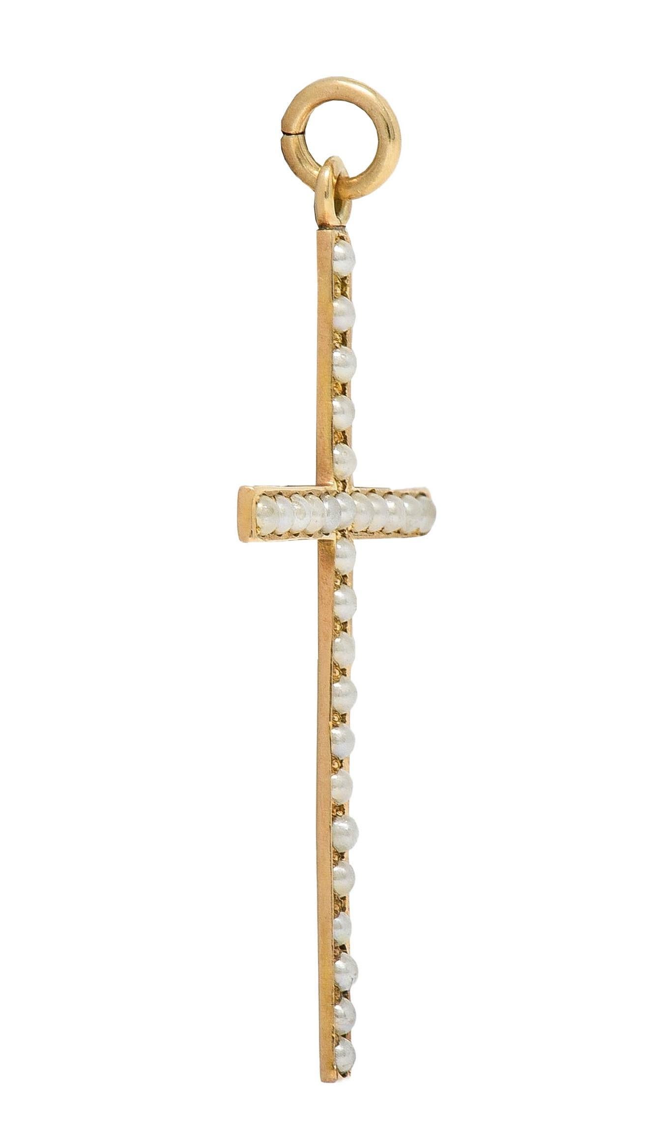 Designed as a cross form suspending from a jump ring bale
Bead set throughout with 2.0 mm round seed pearls
White in body color with subtle iridescence
Tested as 14 karat gold
Circa: 1880s
Measures: 7/8 x 1 1/2 inches
Total Weight: 1.2 grams
Stock