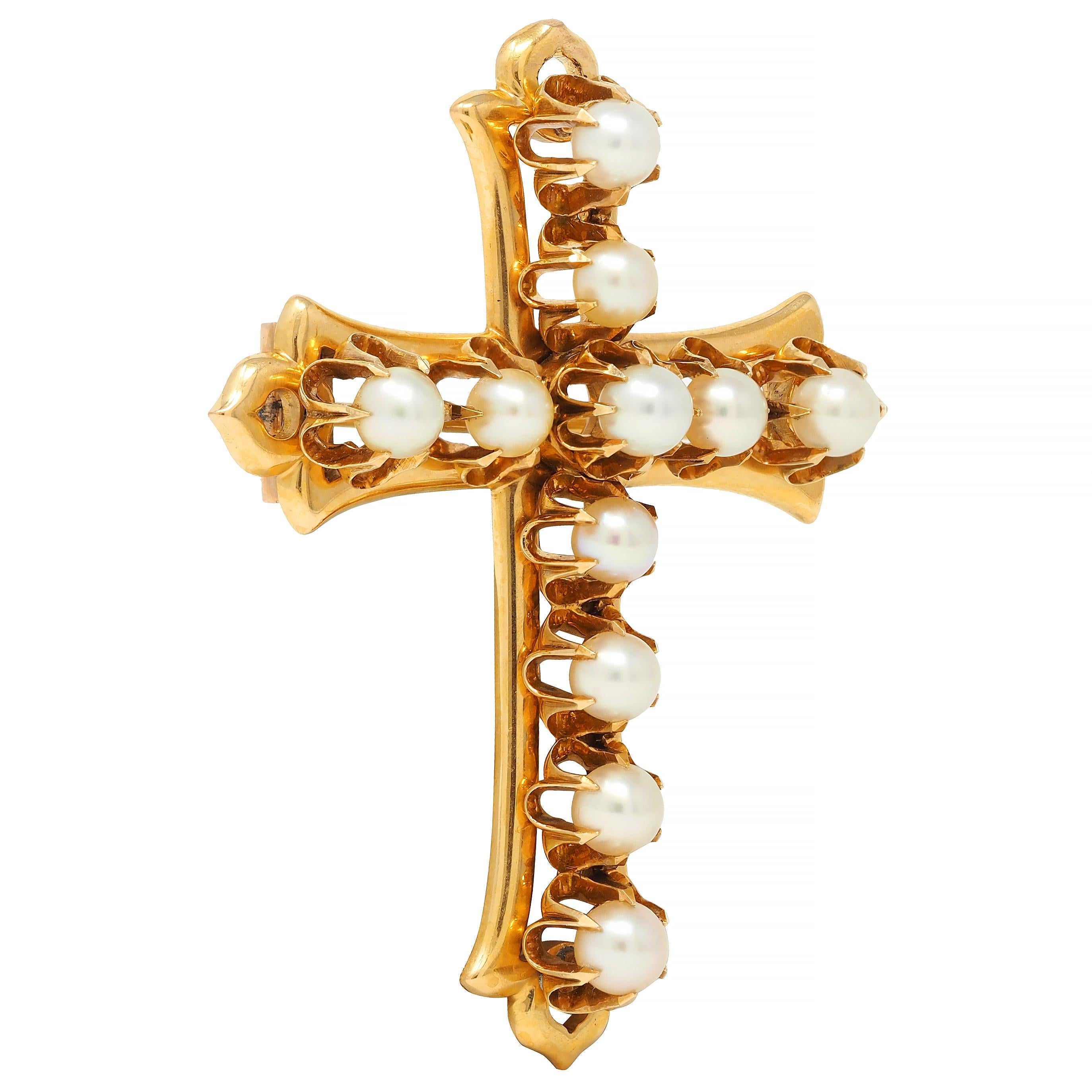 Designed as a pierced cross form with flaring fleur-de-lis motif terminals 
Featuring round pearls prong set in belcher mounts throughout
Gray to cream in body color with strong iridescence
Ranging in size from 4.0 to 4.3 mm 
Completed by hinged