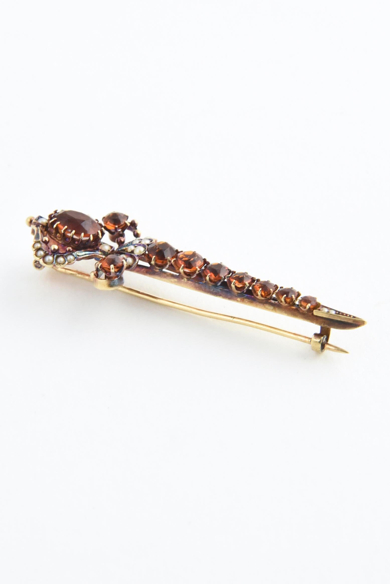 Victorian 14K gold sword brooch featuring 10 graduated size citrine stones, tiny seed pearls, and gold accents.