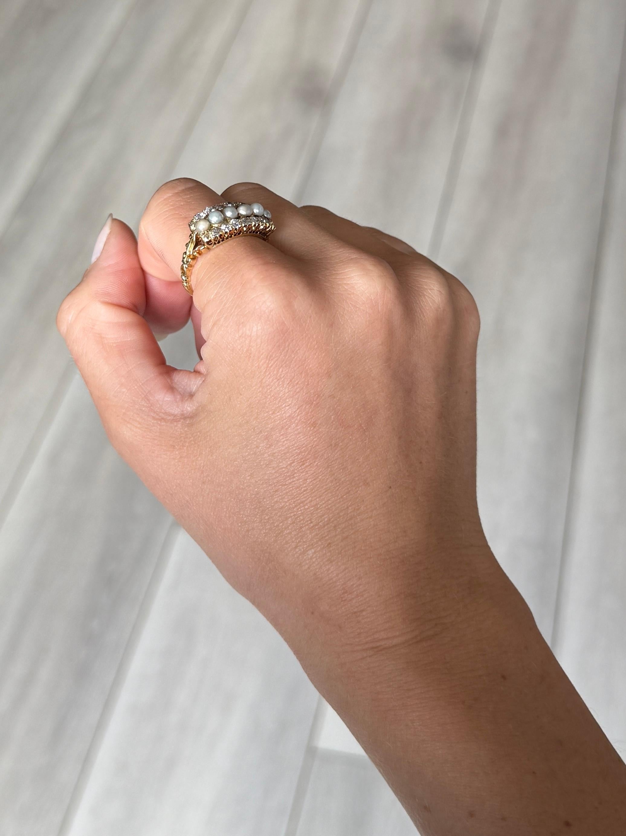 This sweet pearl ring holds six pearls and above and below this row are old mine cut diamonds. The diamond total of this ring is approx 90pts. Modelled in 18carat gold.

Ring Size: Q or 8 
Face Dimensions: 9x20mm

Weight: 5.6g