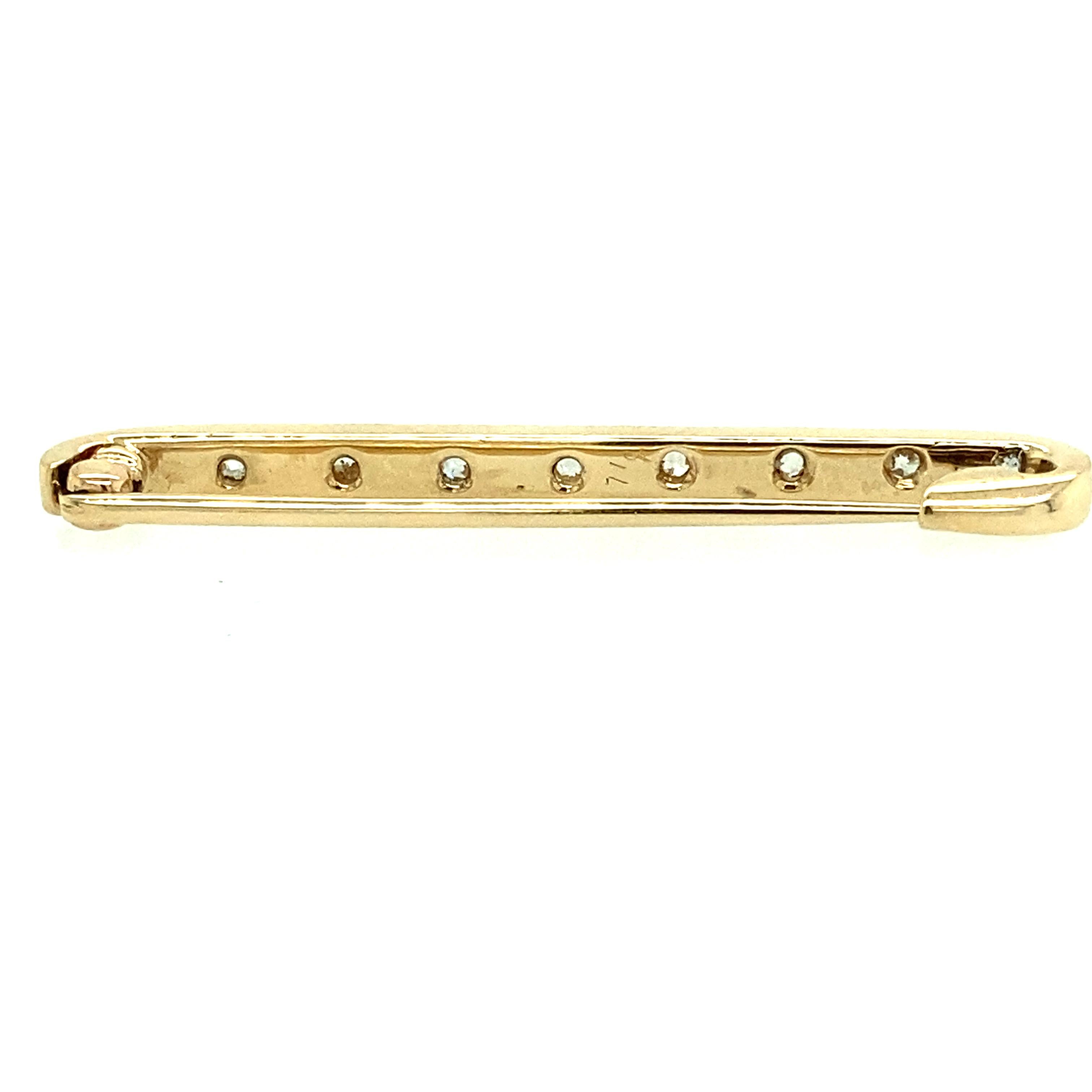 One 14 karat rose gold bar pin set with eight 2.5mm gray cultured pearls and nine old mine cut diamonds, approximately 0.25 carat total weight with matching I/J color and SI clarity.  The pin measures 1.5 inches long and is complete with a