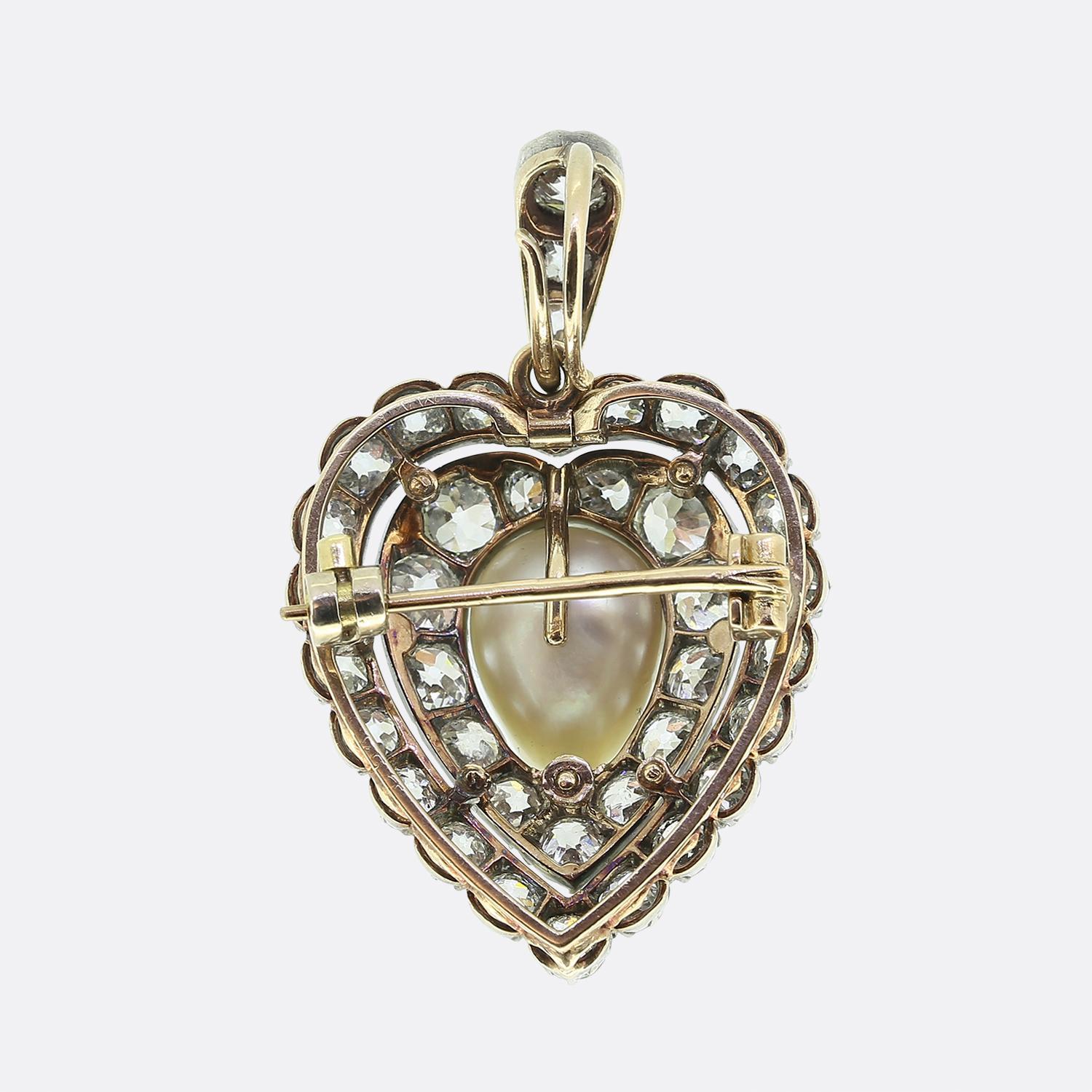 Here we have an exquisite dual-purpose brooch and pendant showcasing a harmonious blend of 18ct gold and silver. At its heart lies a lustrous white pearl, elegantly surrounded by a double open frame of old mine cut diamonds. The diamonds, with their