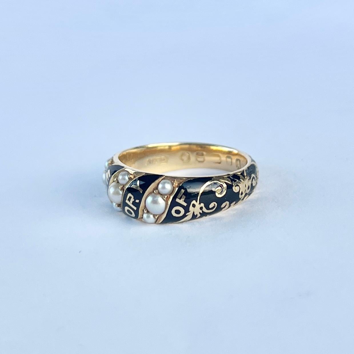 This 18 carat gold and black enamel ring has the words 'in memory of' across the front of it and is set with 9 pearls. The inside of the band is engraved with 'dear Emily Nov 27th 1876'. Fully hallmarked London 1876.

Ring Size: M or 6 1/4  
Band