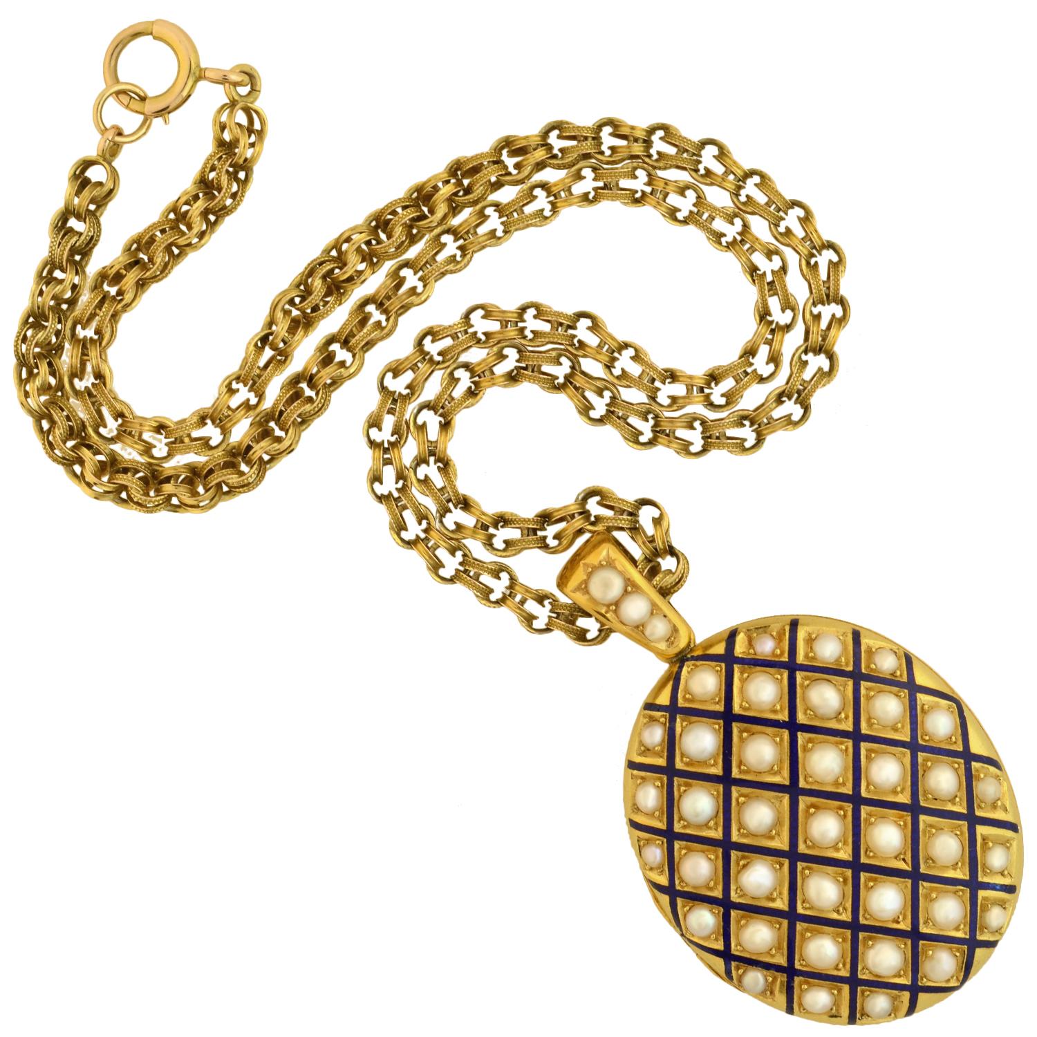 A magnificent 3-piece set from the Victorian (ca1871) era! Crafted in 18kt yellow gold, this impressive ensemble includes a pair of earrings, a locket necklace, and a bangle bracelet. Each piece is decorated with a matching grid-like pattern of