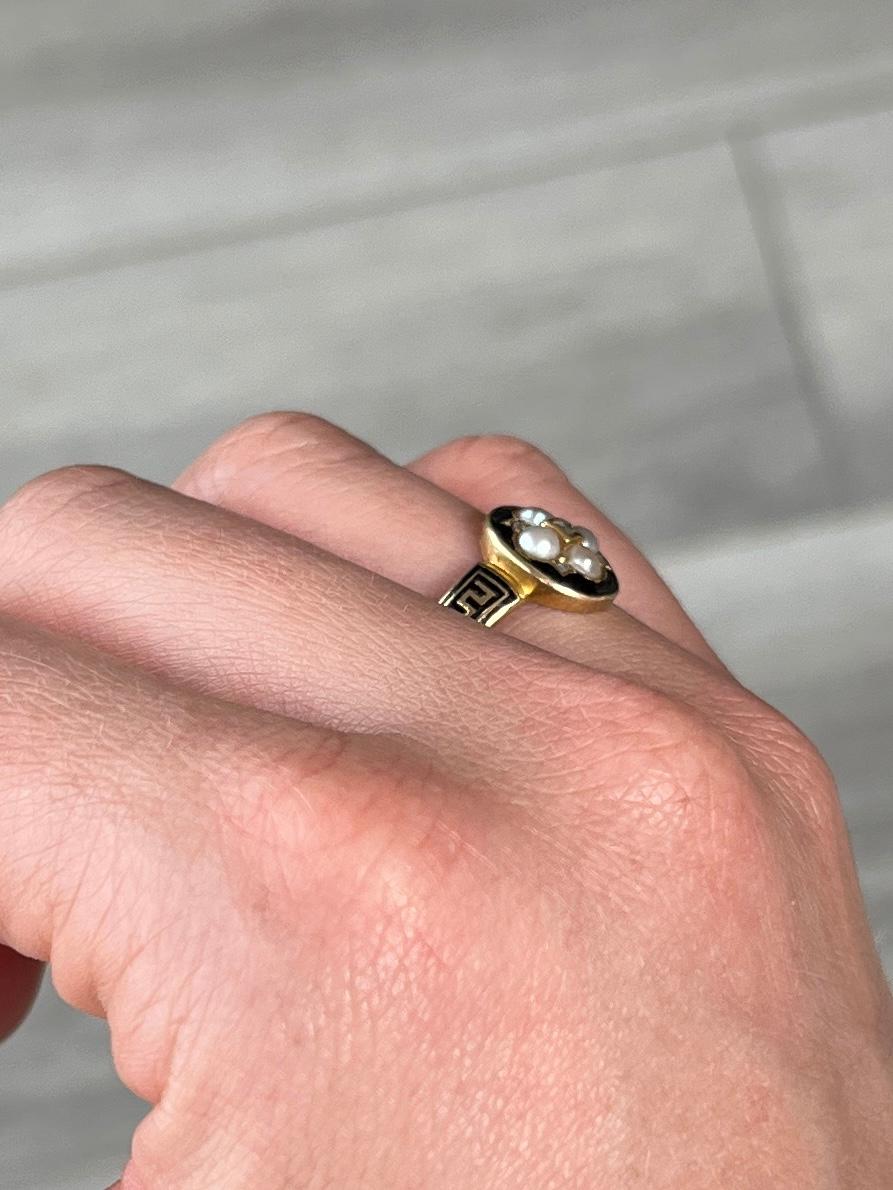 Pretty 18ct gold Victorian mourning ring with decorative panel set with four pearls, five rose cut diamonds and original black enamel all the way around the band and on the front of the panel. The inside of the ring is engraved with 'Lucy Laved Obt