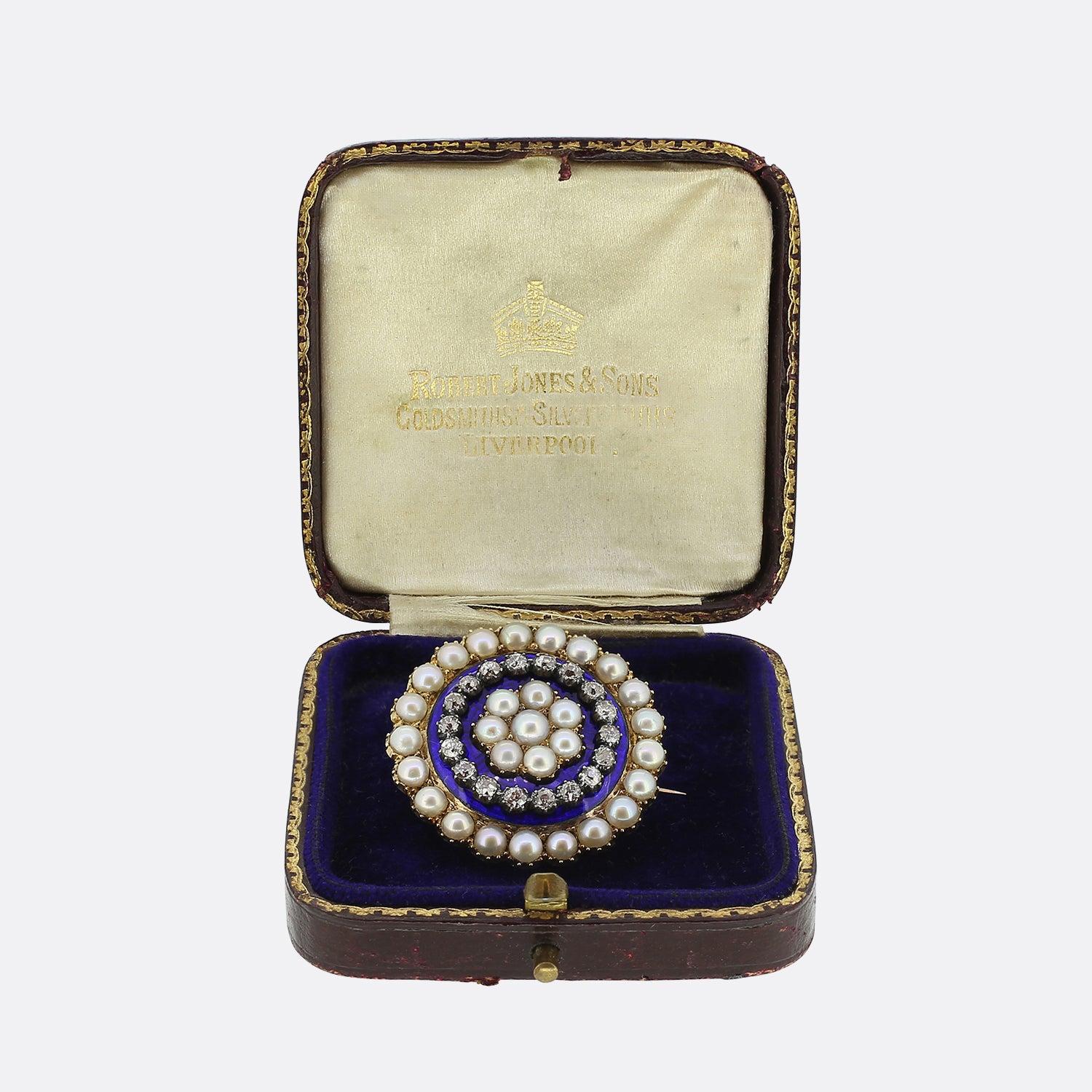 This is a Victorian 15ct gold pearl and diamond double heart brooch. The brooch features a rose cut diamond double heart motif crafted in silver within a blue and white enamel centre section. Surrounding the outside of the brooch are twenty eight