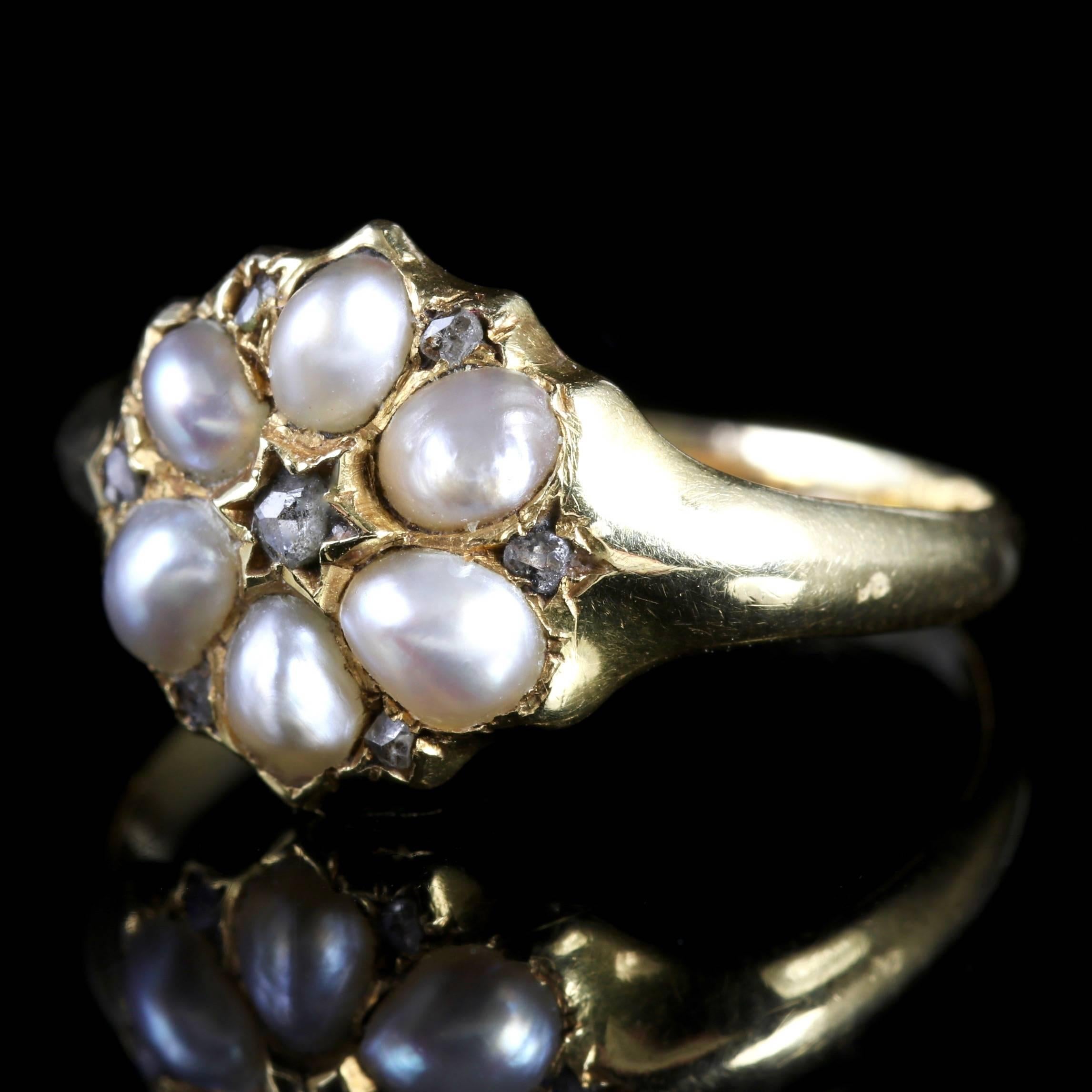 This fabulous Victorian star-set cluster ring is adorned with six lustrous natural pearls, six rose cut Diamonds which surrounds the Pearls, finishing with a rose cut Diamond in the centre, Circa 1900.

A rose cut Diamond resembles the shape of a