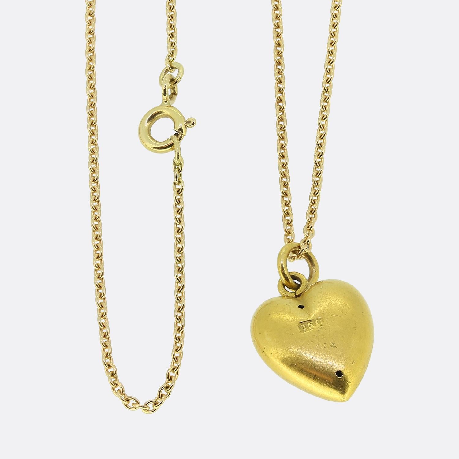 Here we have a charming pearl pendant necklace. This antique pendant has been crafted from 15ct yellow gold into the the shape of a little love heart and expertly set with a single round shaped natural pearl at the centre. This focal stone has been
