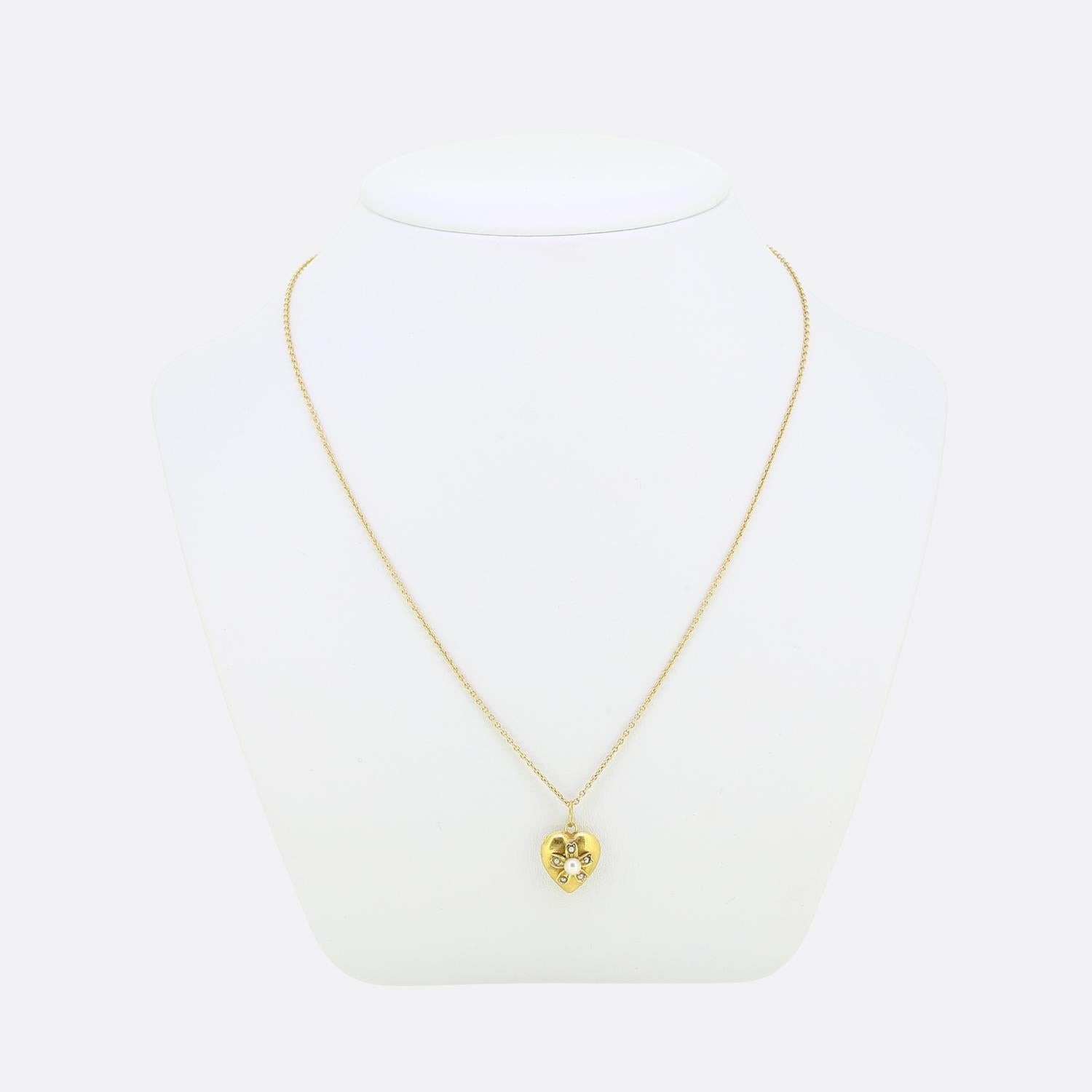 Here we have a wonderful pearl set pendant necklace. This antique pendant has been crafted from 18ct yellow gold into the the shape of a little love heart and expertly set with a single round shaped natural pearl at the centre. This focal stone is