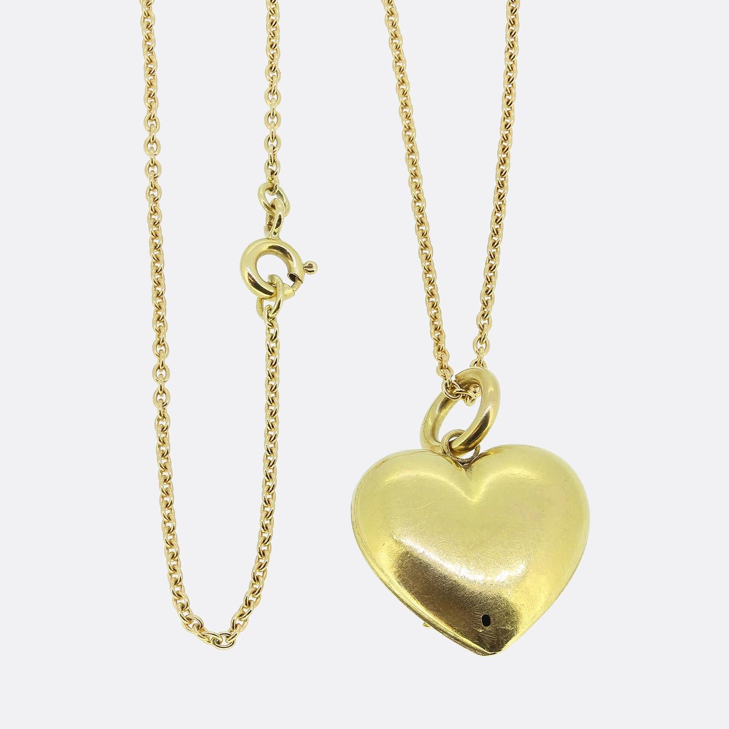 Here we have an excellently crafted 15ct yellow gold pearl set pendant necklace. This antique pendant takes on the shape of a love heart which plays host to a finely detailed three leaf clover motif at the centre. This design has been set with a