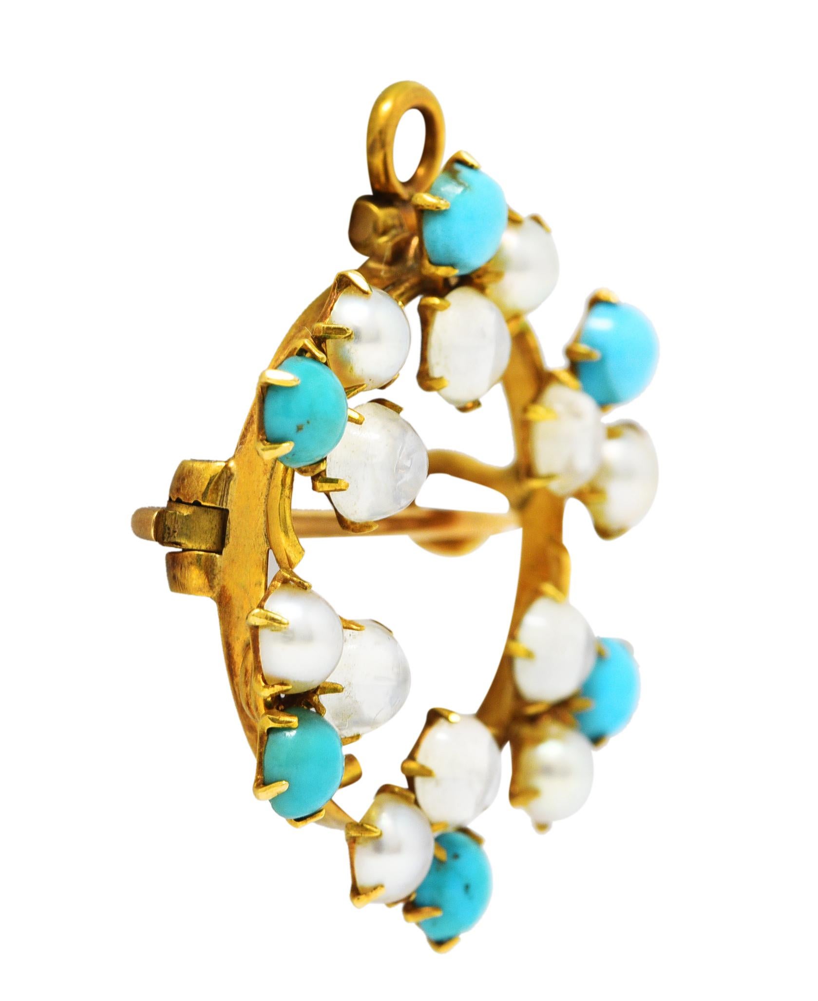 Brooch is designed as a gold circular wreath of clovers with prong gemstone petals. Comprised of pearl, turquoise, and moonstone 3.5 mm round cabochons. Pearls are rosé in body color with moderate iridescence and good luster. Turquoise are