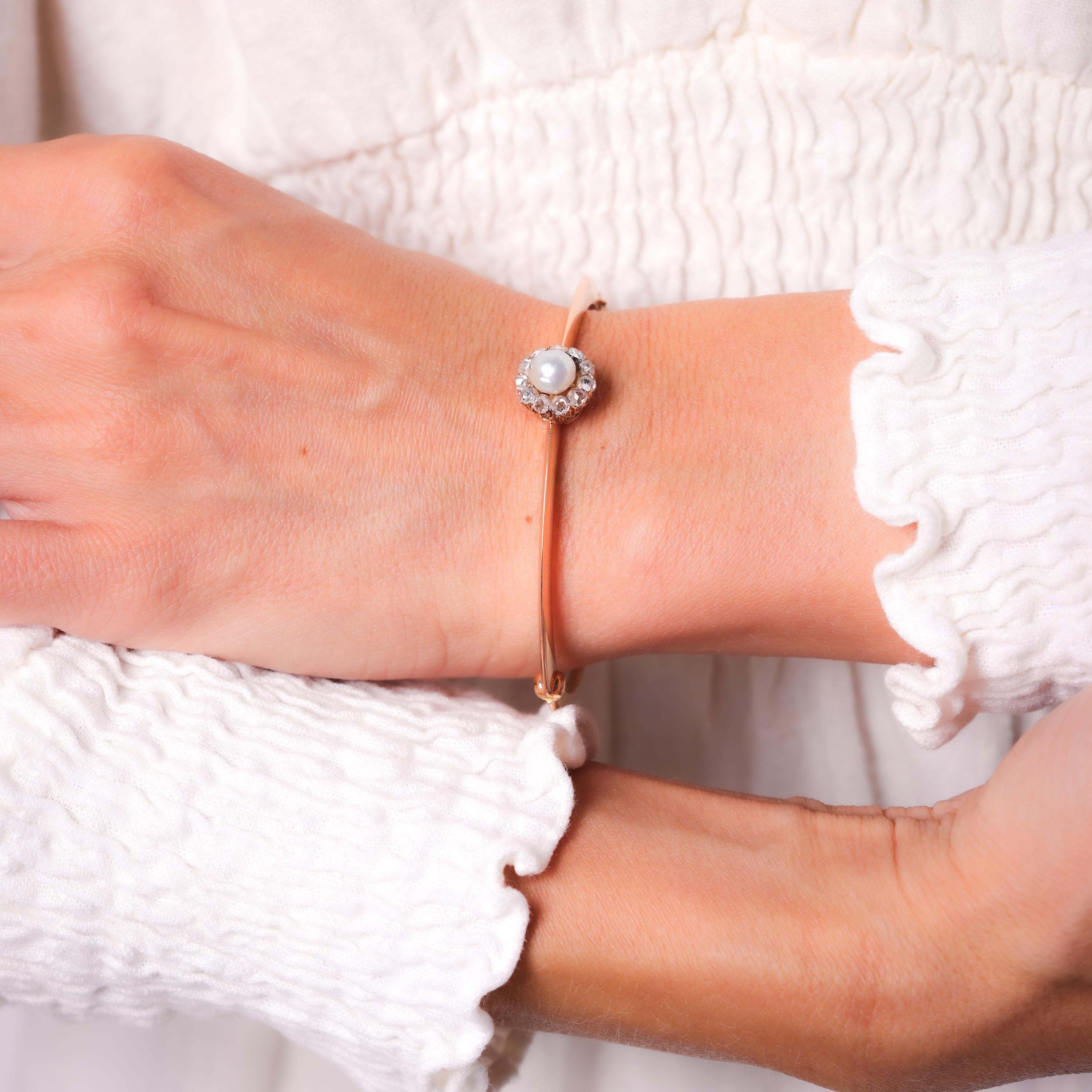 Center Stone: Pearl
Size: Approximately 6.53mm
Accent Stone: 11 Rose Cut Diamonds
Weight: Approximately .60 Carats
Color: G
Clarity: I
Metal: 18K Rose Gold 
Era: Victorian 
Circa: 1860's 
Size: 2 3/8 in diameter
Gram weight: 17.29

This elegant