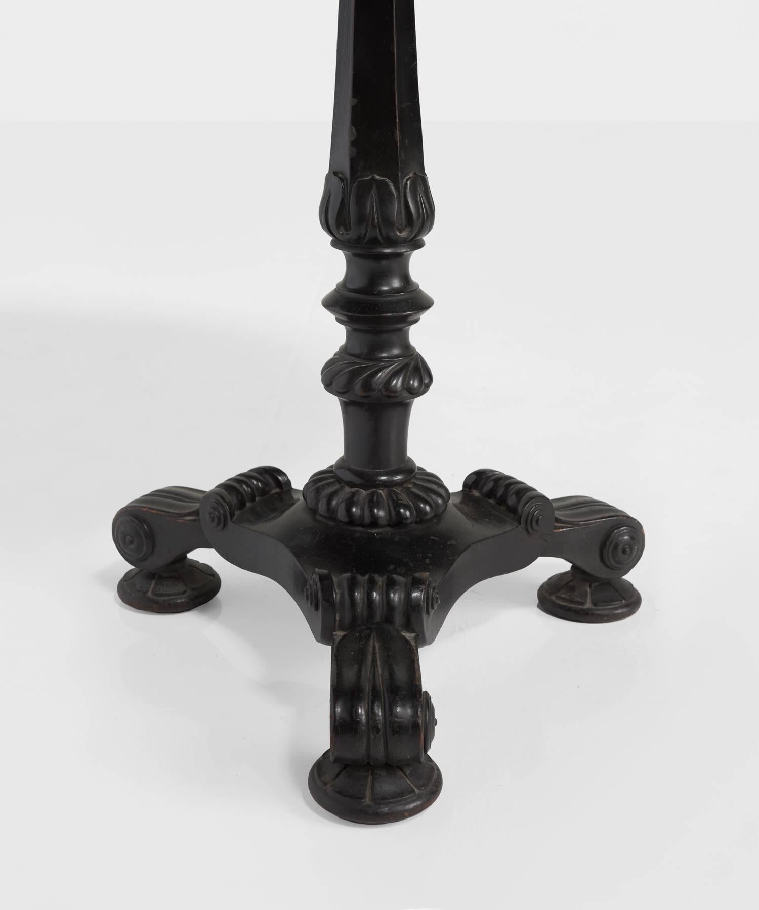 Victorian pedestal table, circa 1840

Black lacquered, gilt and polychrome decorated pedestal table with papier-mache construction. A beautifully painted top features a floral bouquet, birds, and a fountain, centered on a gilt trellis border.